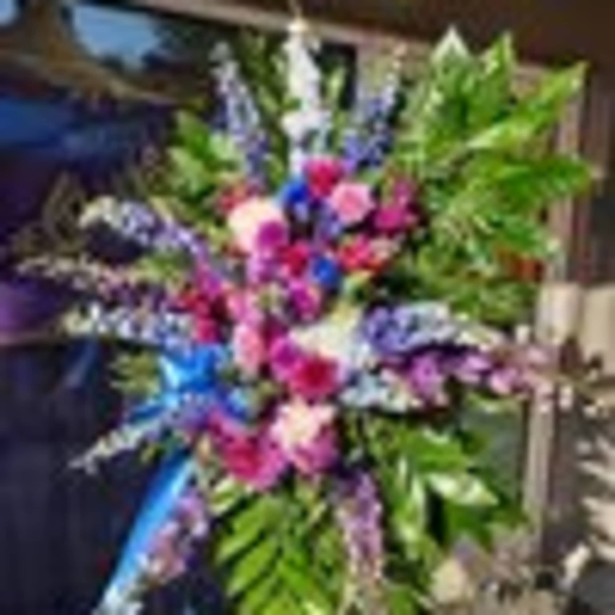 A splendid display of blue and Lavender roses, blue and purple Delphinium A splendid display of blue and Lavender roses, blue and purple Delphinium