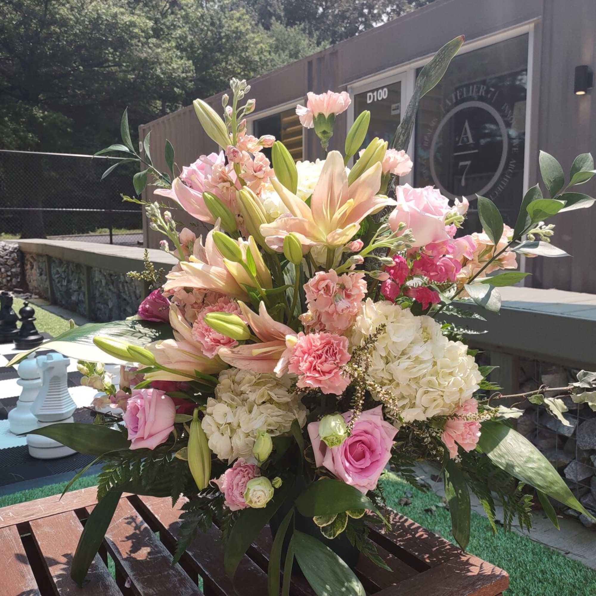 A standing Spray and floor basket with a Premium or Standard blooms A standing Spray and floor basket with a Premium or Standard blooms