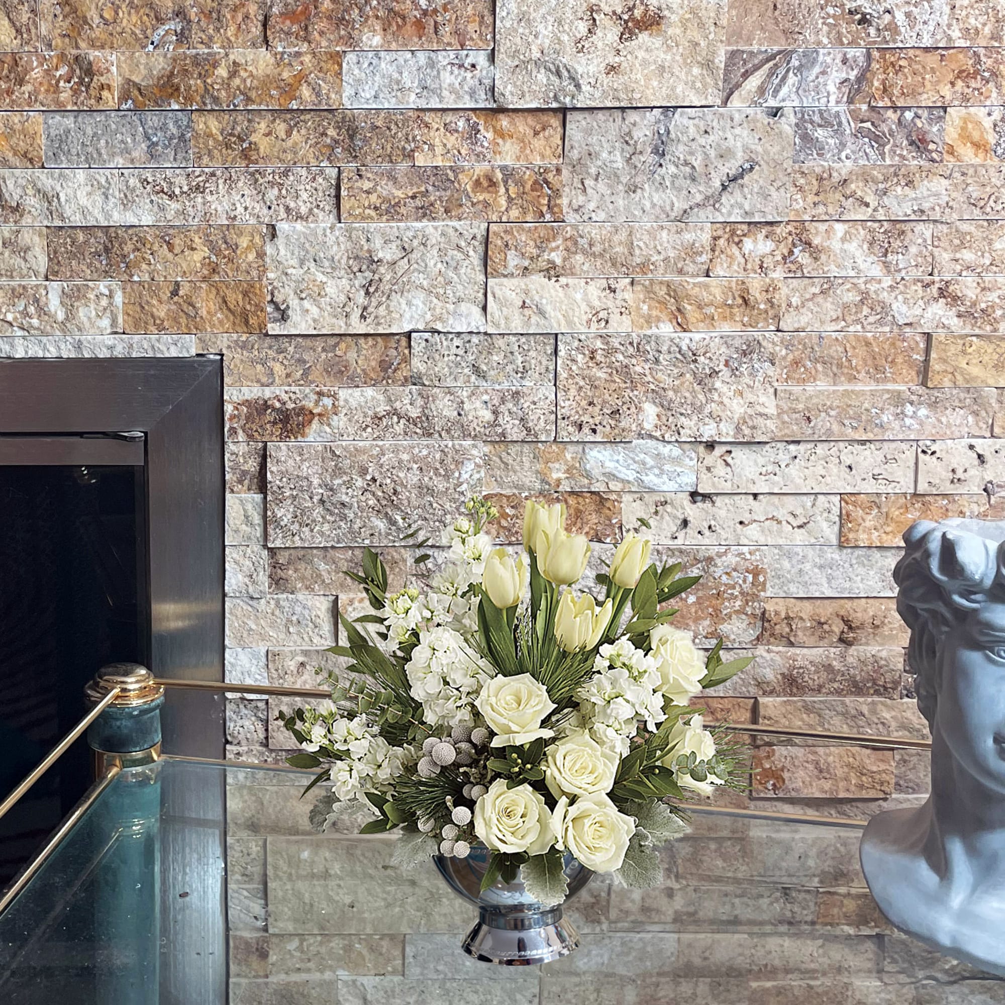 A stylish pop of winter style, this snow-white bouquet in a silver A stylish pop of winter style, this snow-white bouquet in a silver