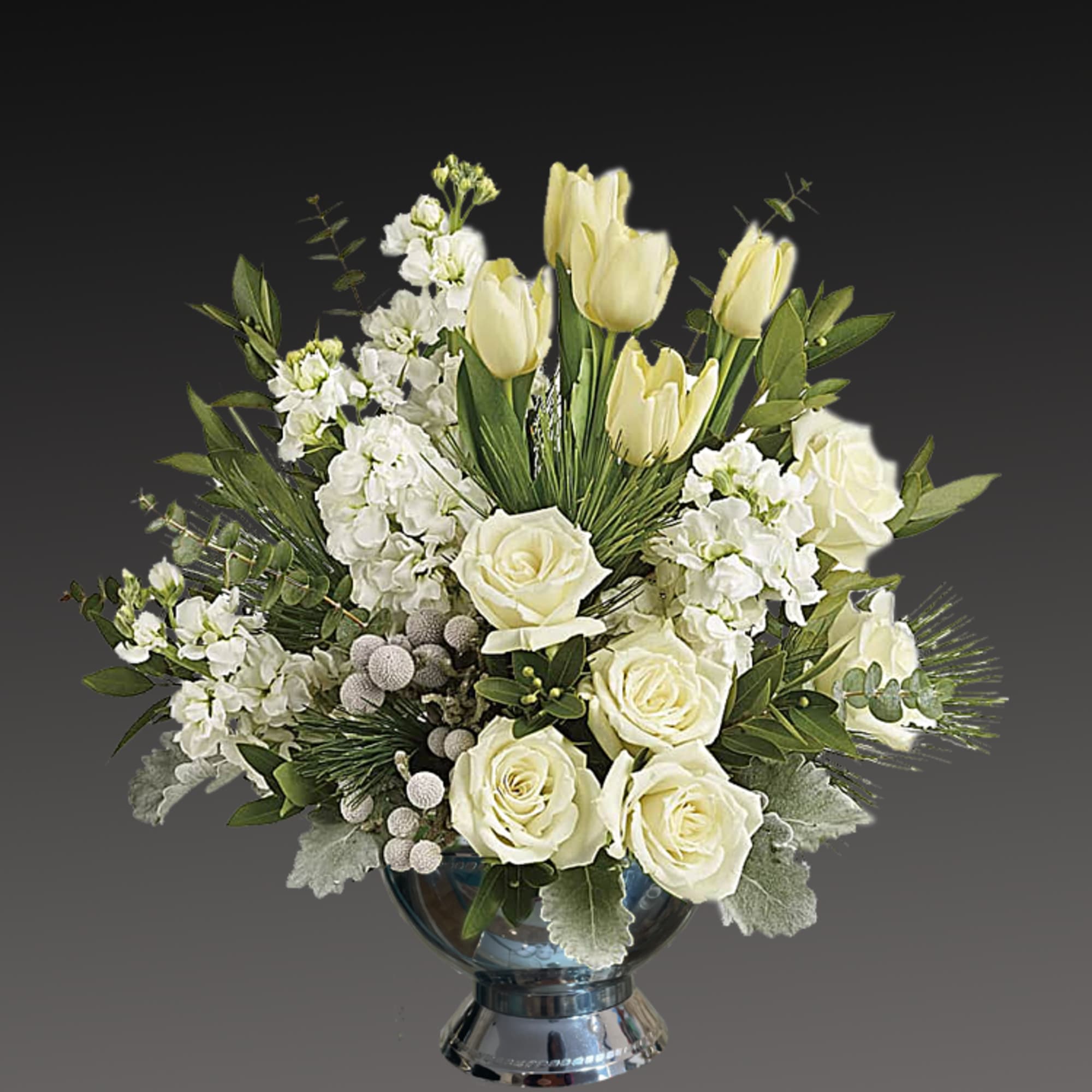 A stylish pop of winter style, this snow-white bouquet in a silver A stylish pop of winter style, this snow-white bouquet in a silver
