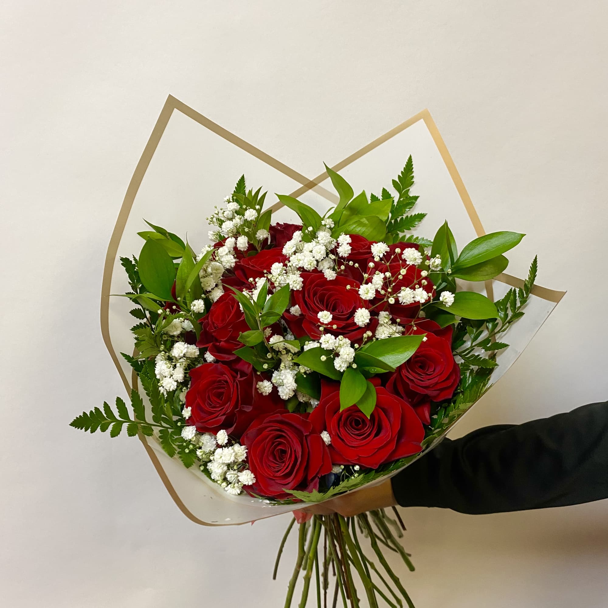 A Dozen Roses Wrapped with Babies Breath and Greenery. Vase Not Included

Write