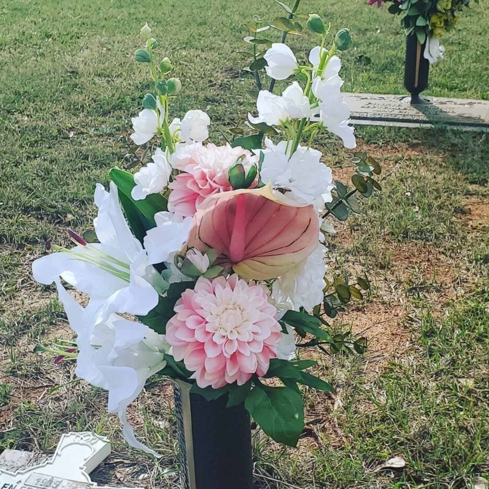 “Gone from sight, but not our hearts”
An arrangement of assorted artificial flowers “Gone from sight, but not our hearts”
An arrangement of assorted artificial flowers