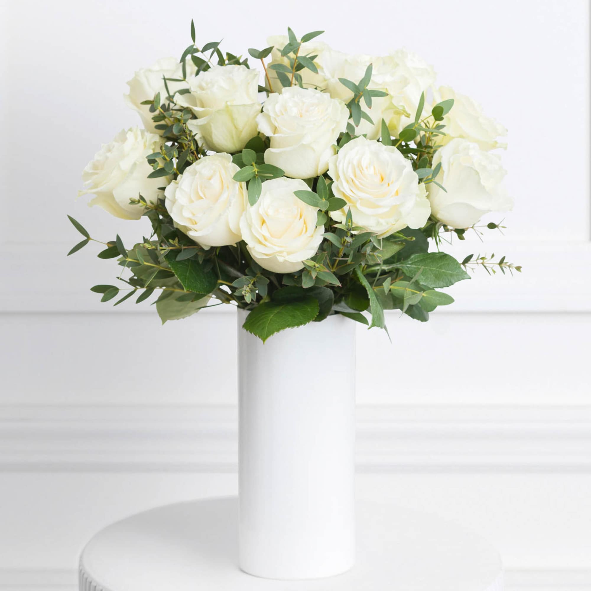 - 12 (Regular), 24 (Deluxe) or 36 (Premium) white roses
- Stems are