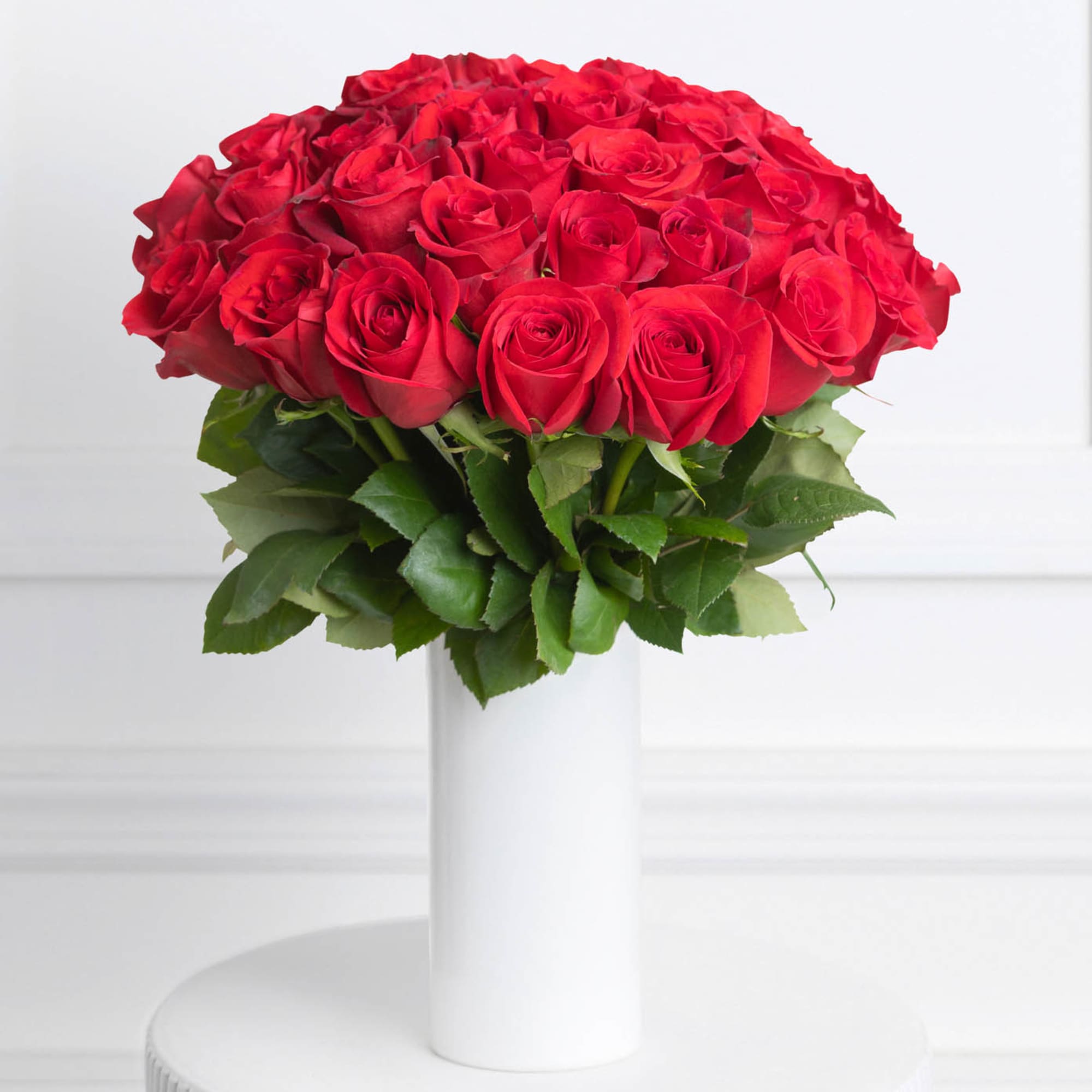 - 12 (Regular), 24 (Deluxe) or 36 (Premium) red roses
- Stems are