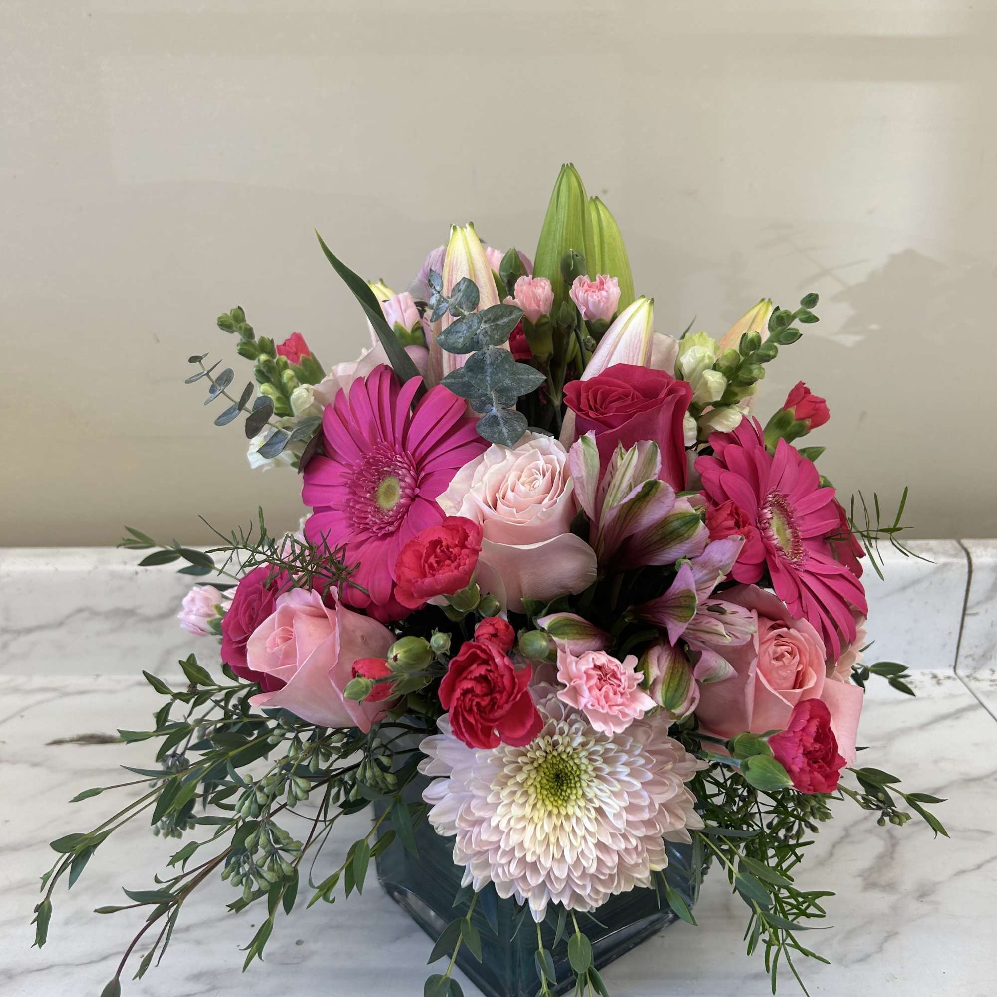 Arrangement of all shades of pink flowers