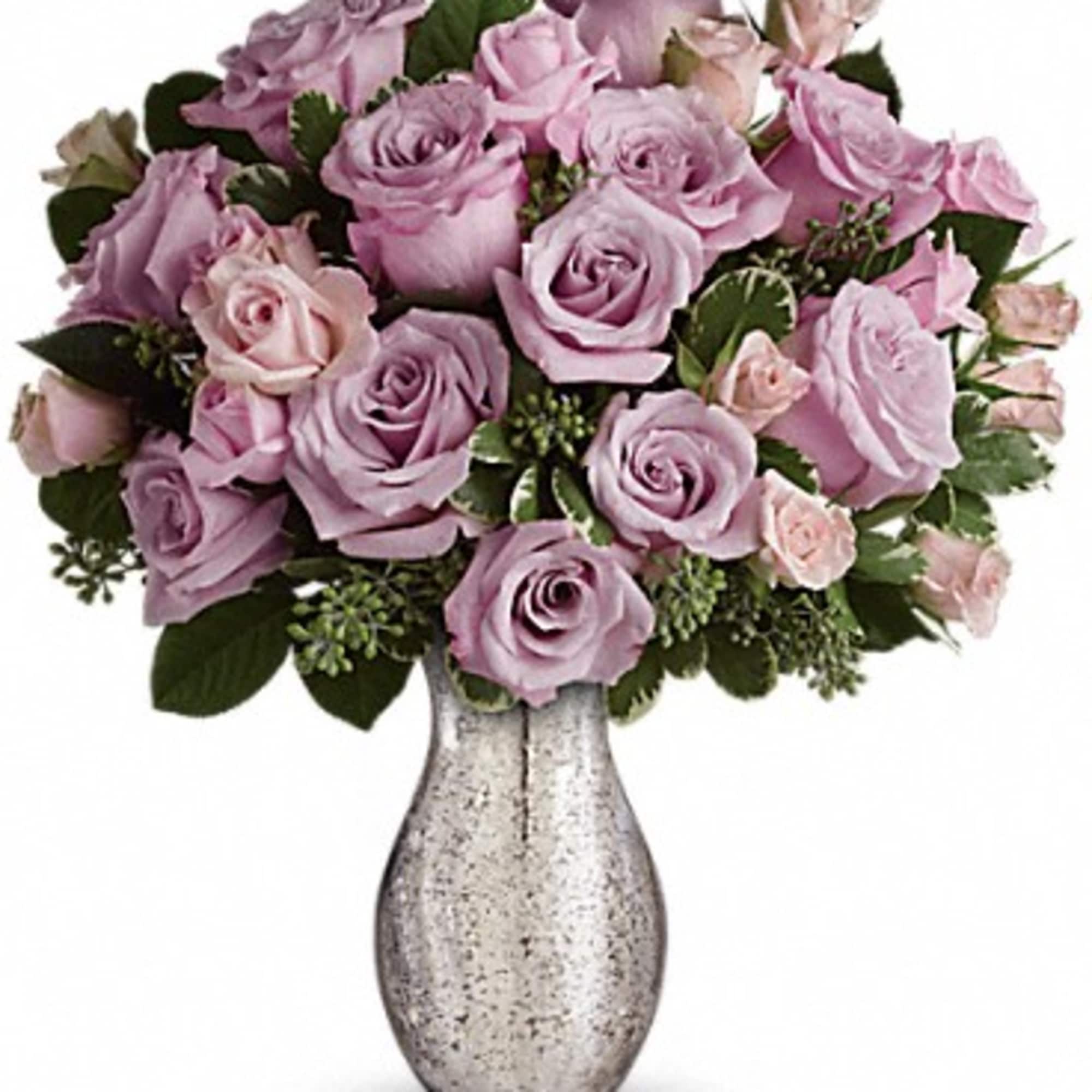A sparkling mercury glass vase lends a feeling of vintage romance to