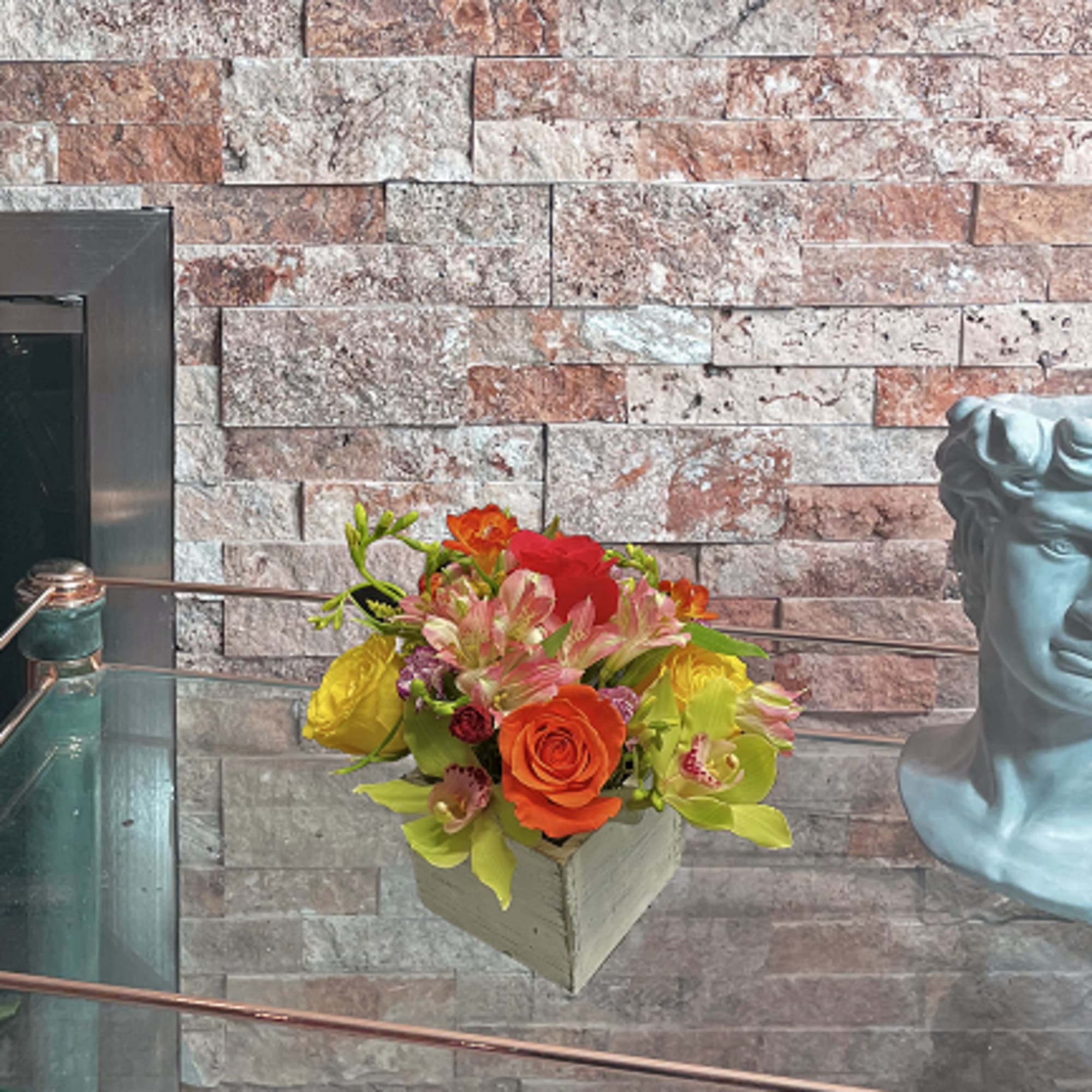 Cymbidium orchid with orange roses is the best match in their dream.