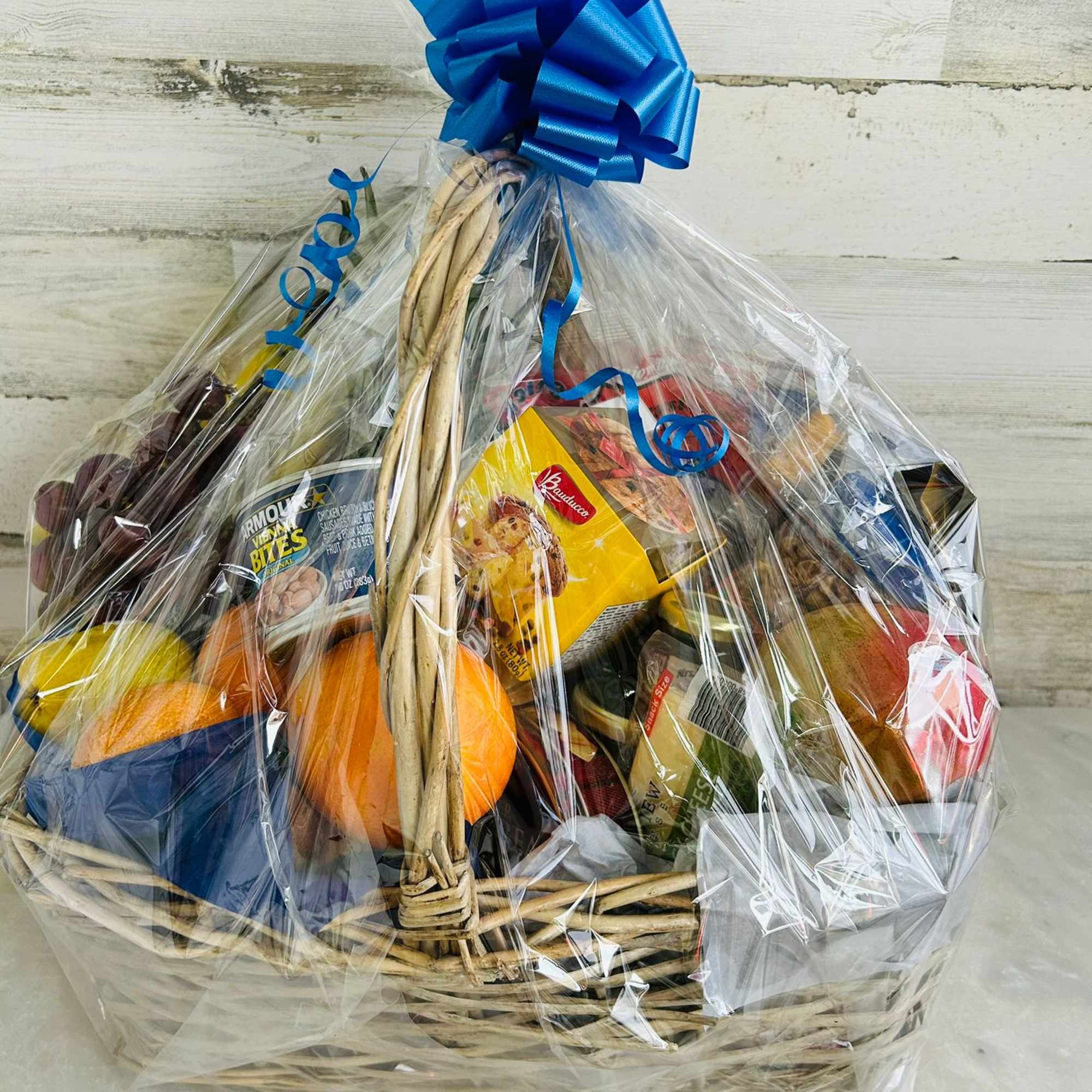 Mix of gourmet items and fresh fruits.