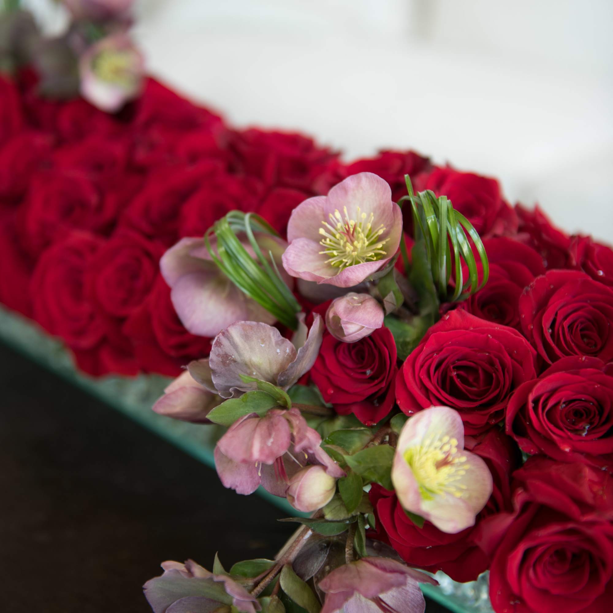 Luxury statement piece made using 6 Dozen Scarlet Red roses with an