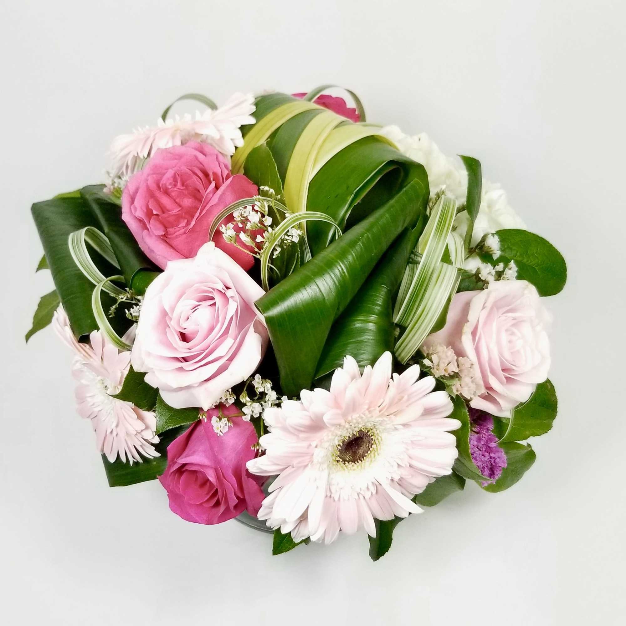 Modern Arrangement of Premium Pink Roses, Gerberas, Hydreangea, Statice, Lily Grass, and