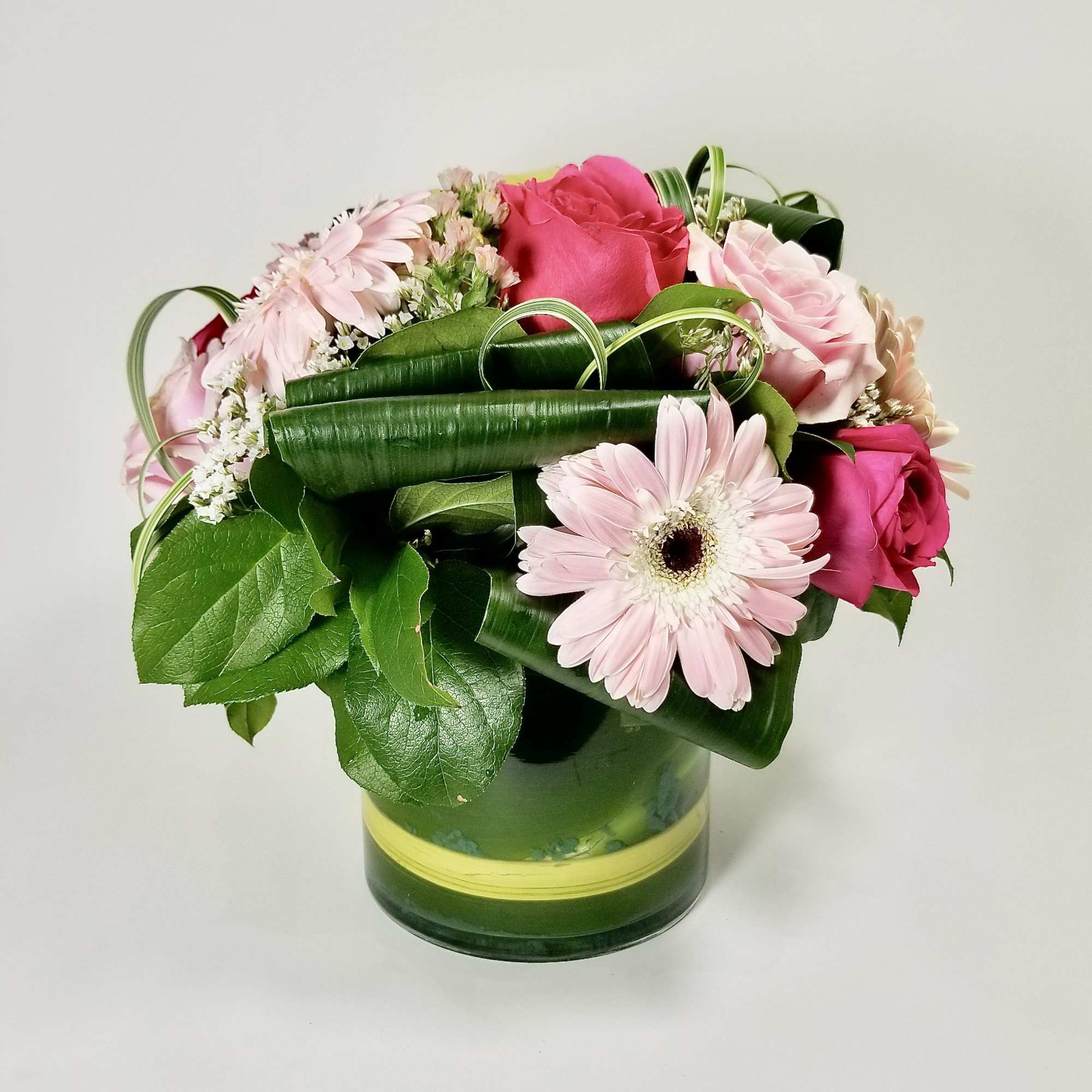 Modern Arrangement of Premium Pink Roses, Gerberas, Hydreangea, Statice, Lily Grass, and