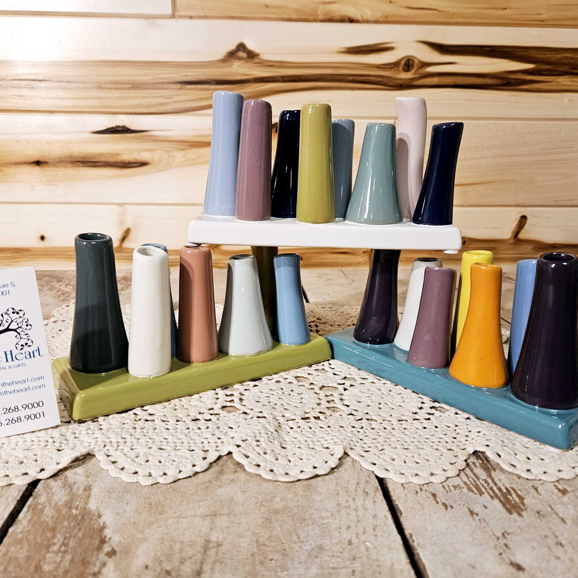 a ceramic vase with flowers to match the vase. There are a