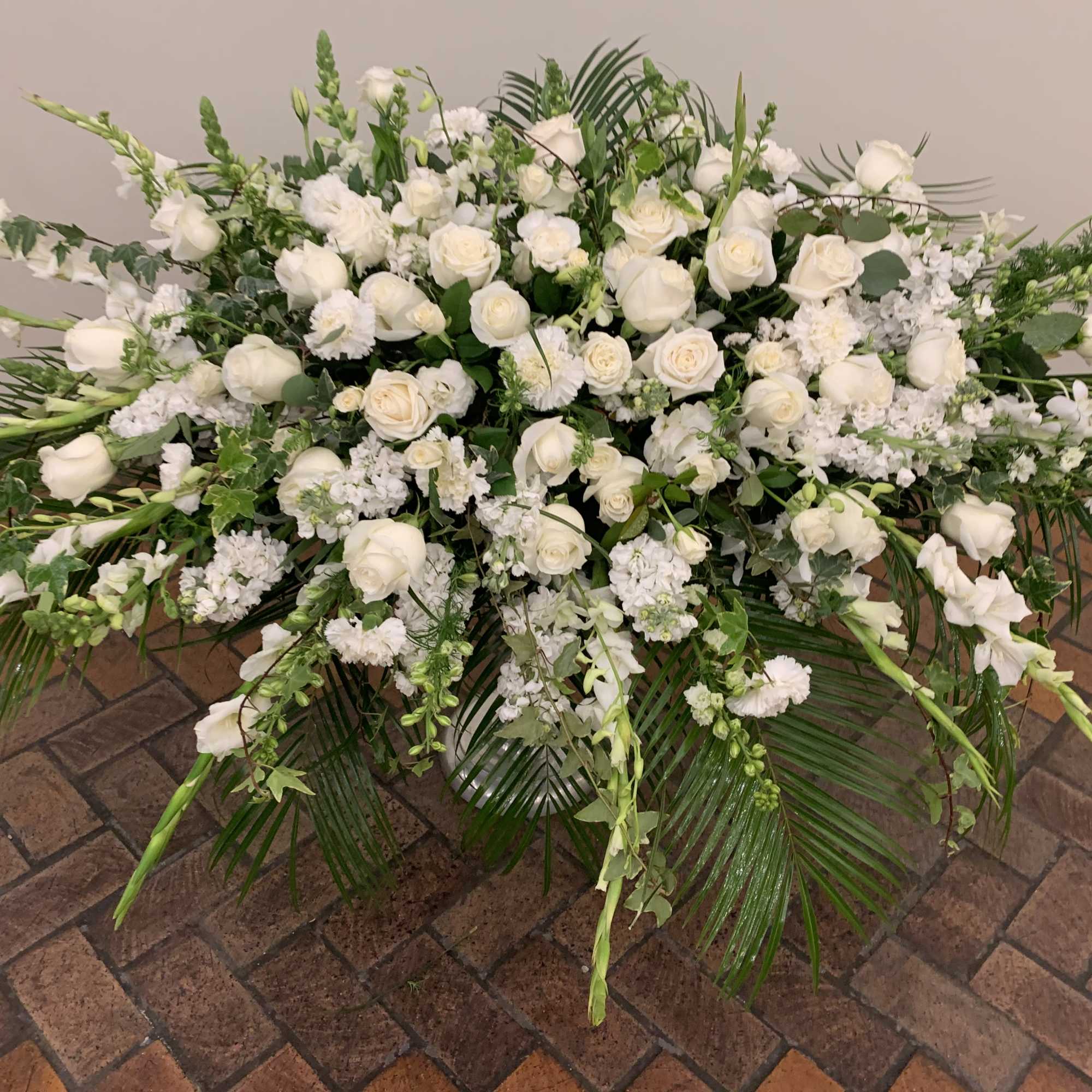 Packege of 4  arranments casket piece, standing spray, holly cross and