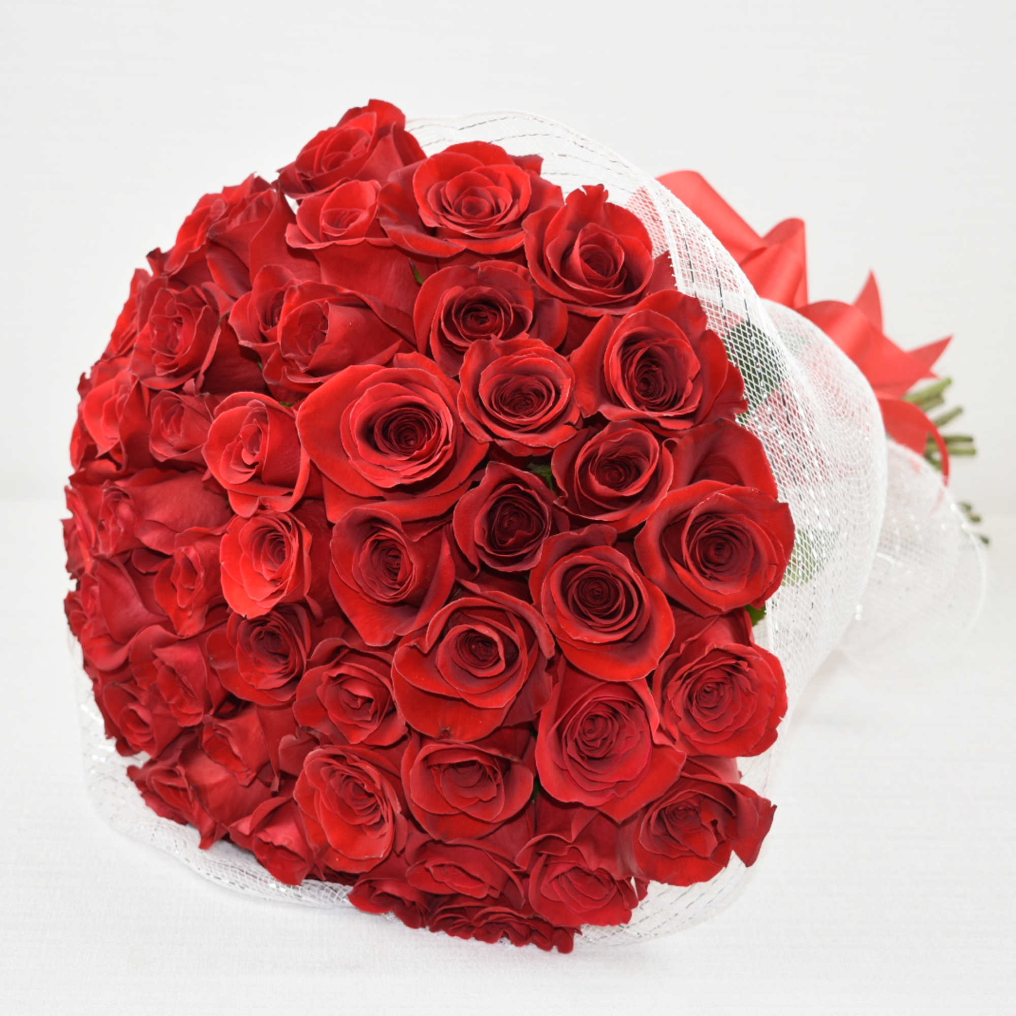 50 beautiful Ecuadorian red roses 
wrapped in the perfect white mesh with
