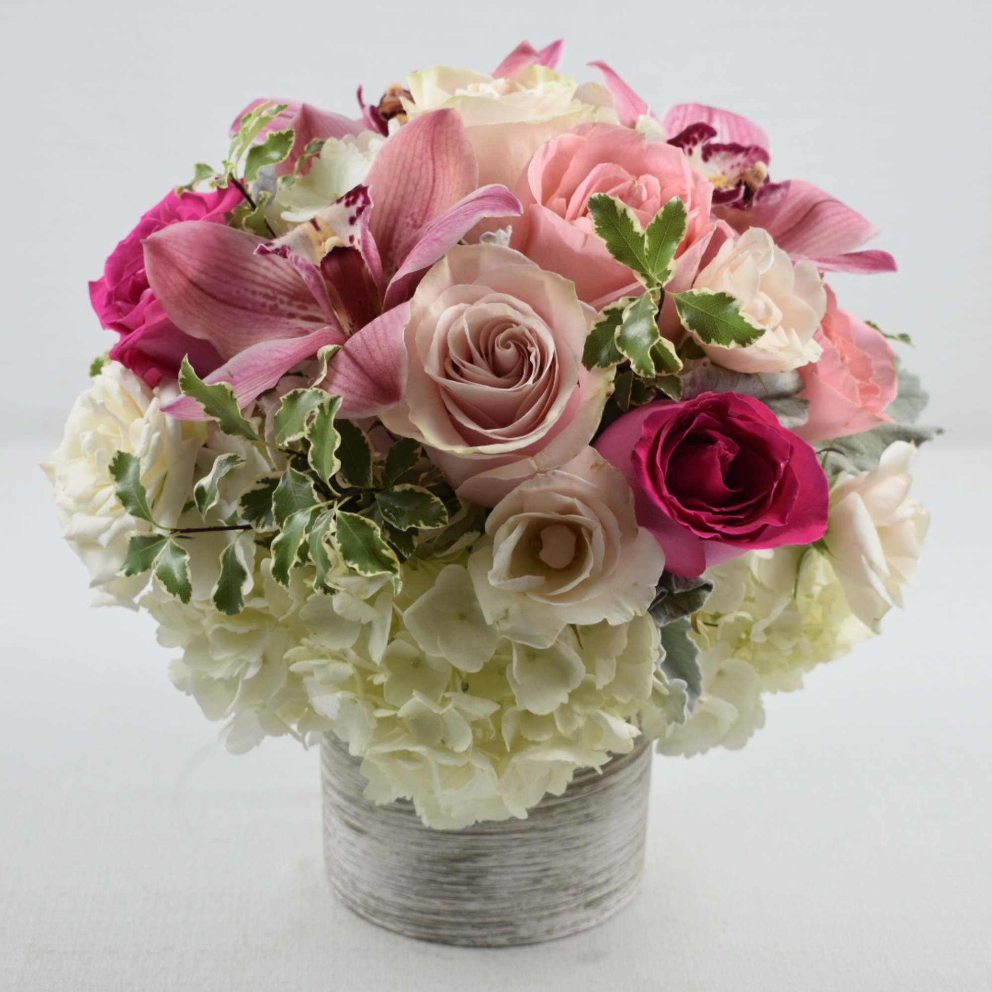 This beautiful small arrangement is the perfect gift for any occasion 
It