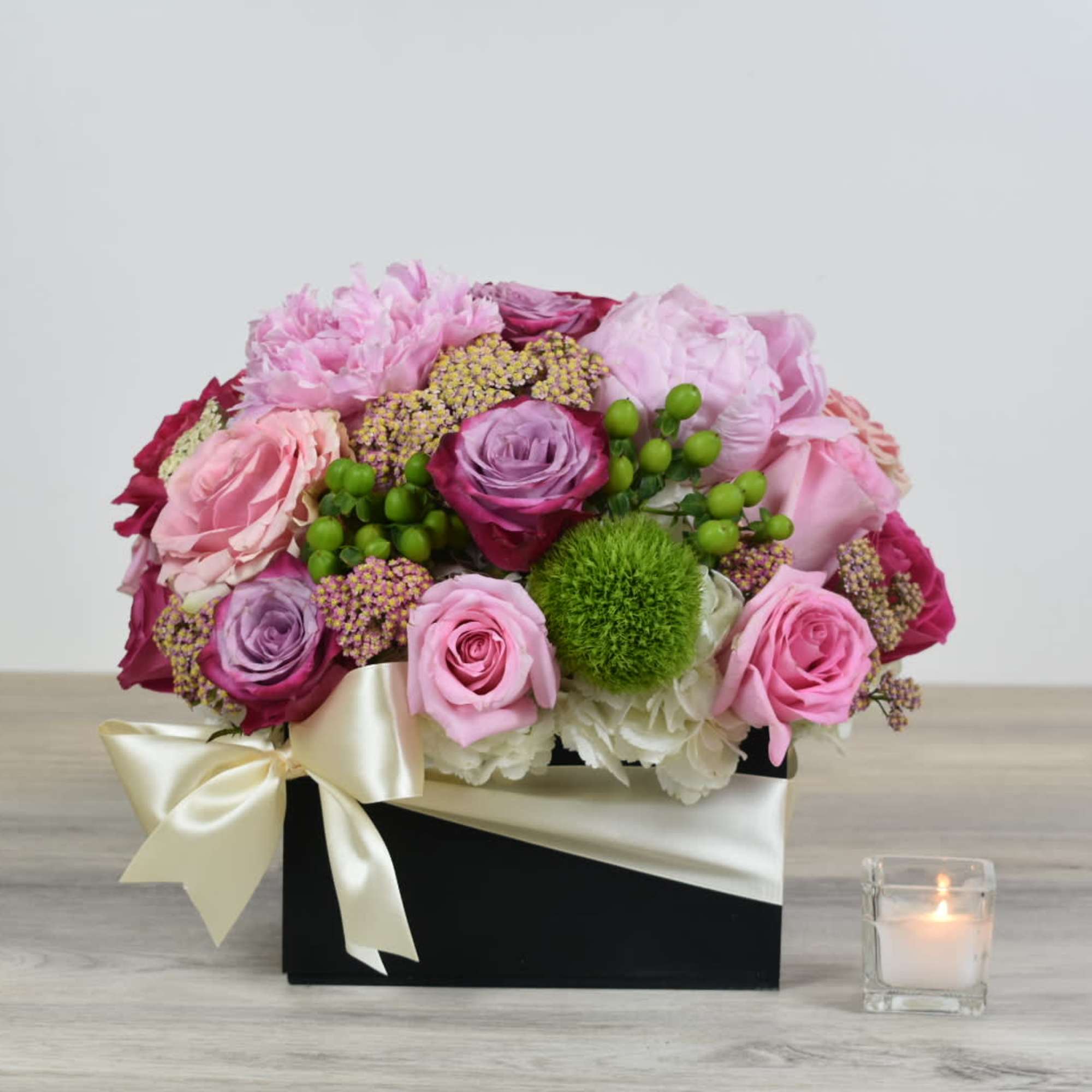 Lady Anne comes in a black wooden box 
With white hydrangeas, pink