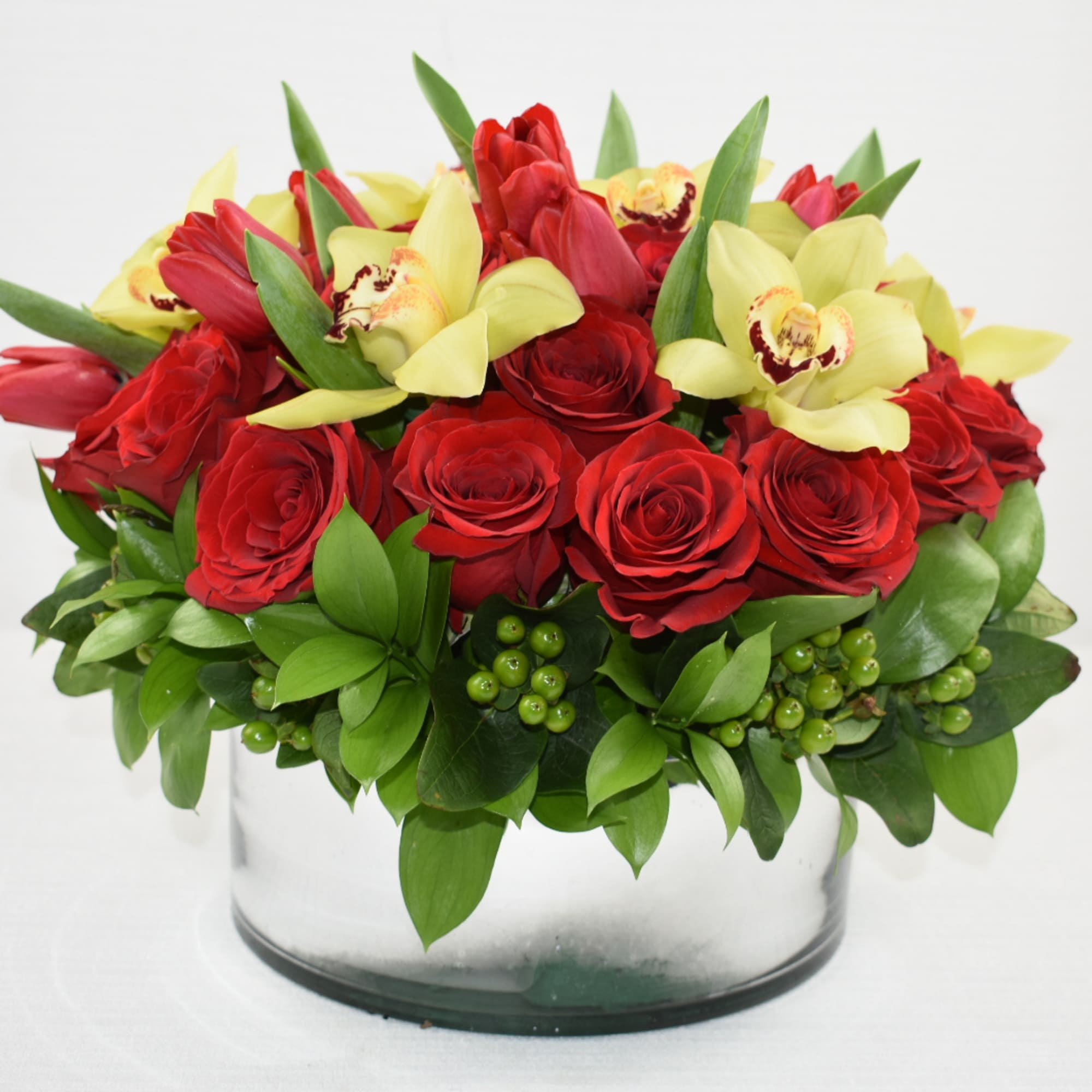 Lovely floral arrangement in a round low vase 
with 3 dozen Ecuadorian