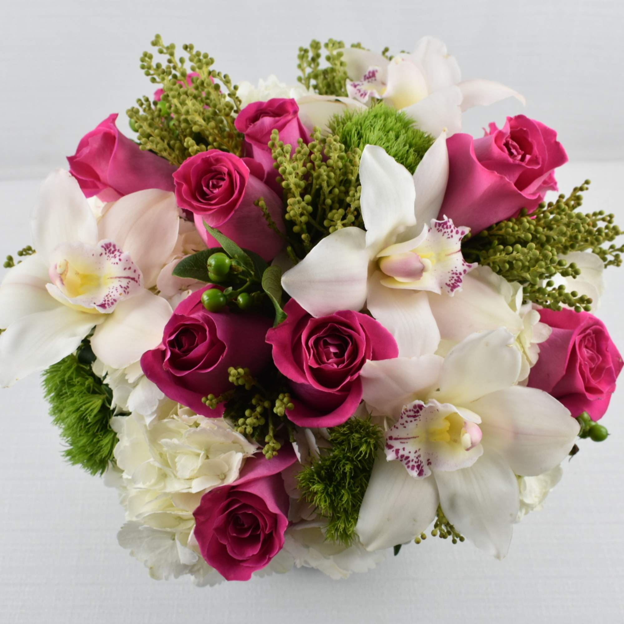 Her Majesty is a floral arranged with white hydrangeas hot pink Ecuadorian