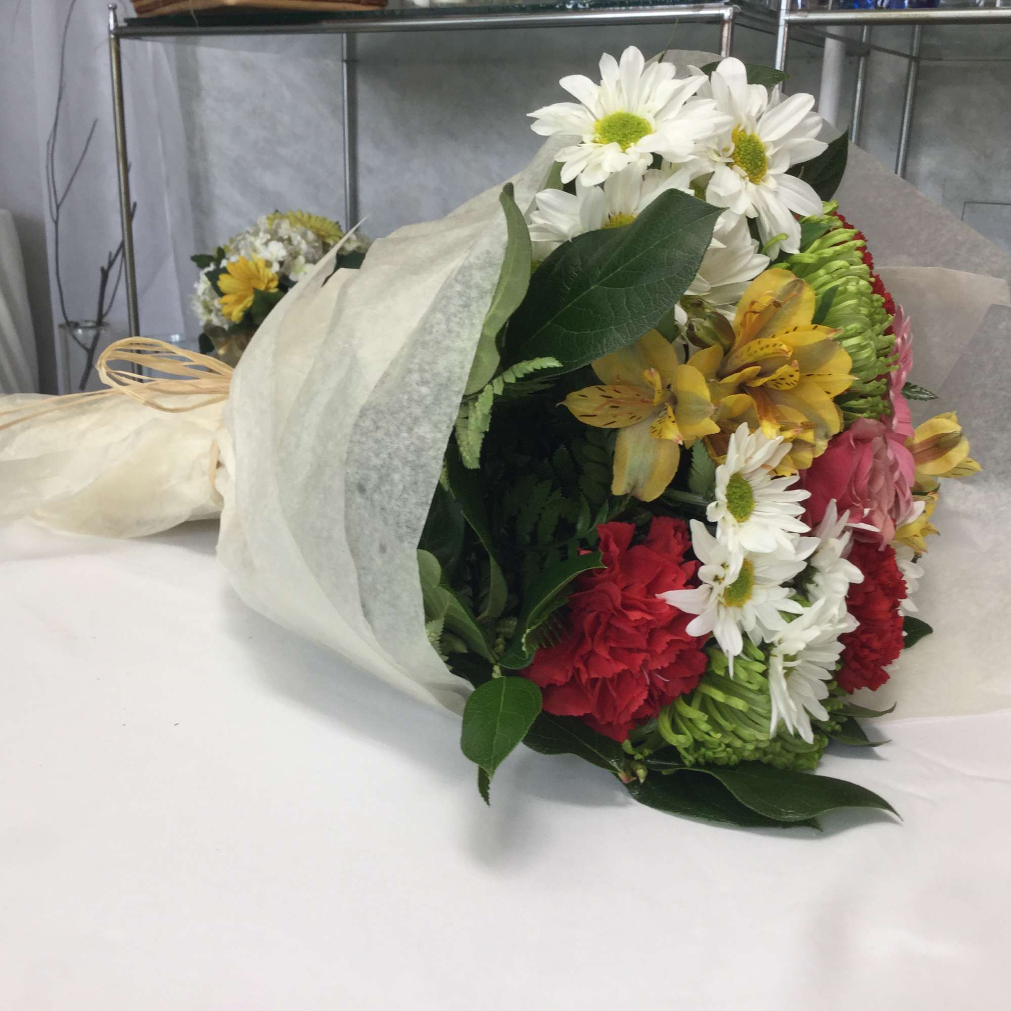 This stunning bouquet of fresh mixed flowers is full of life, love