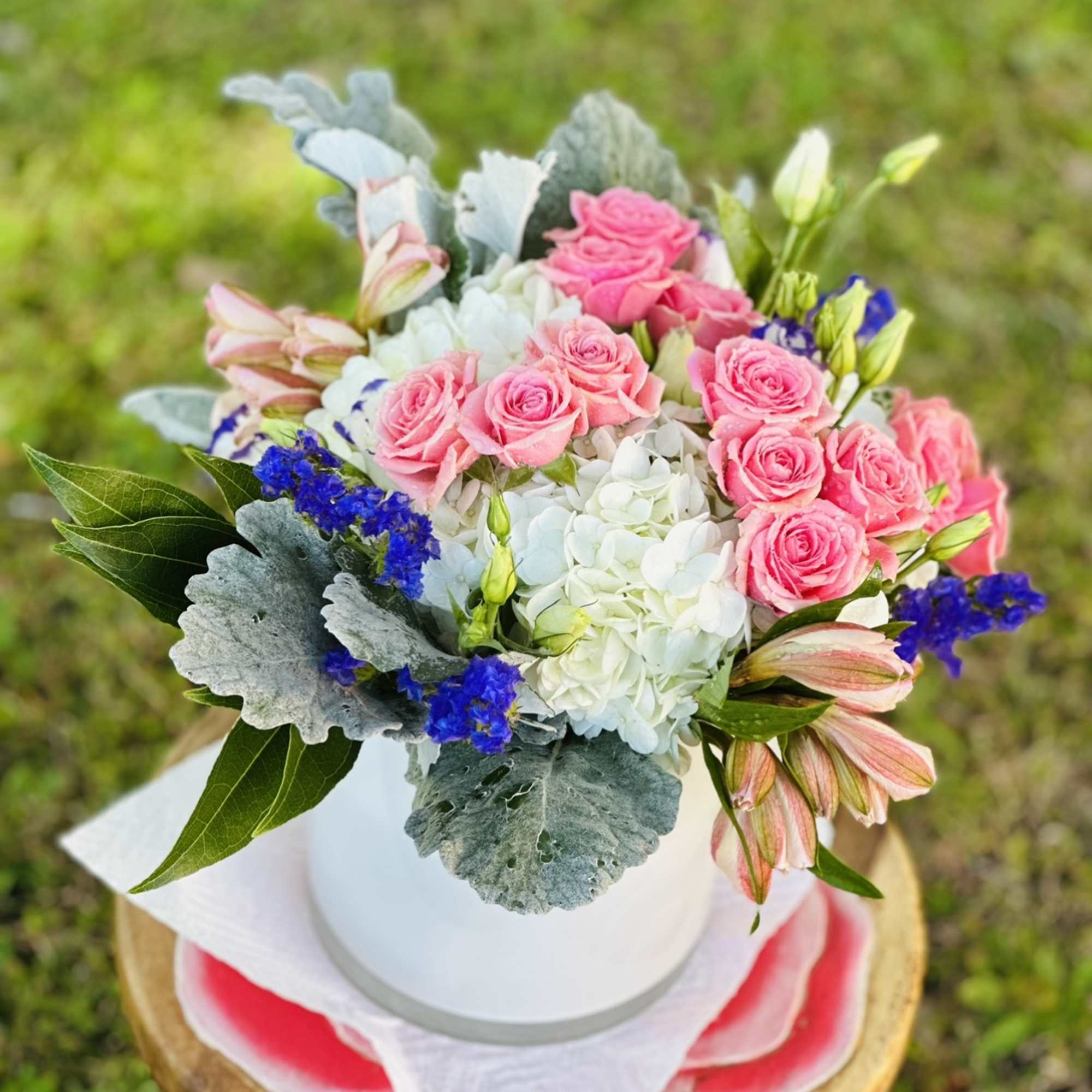 This angelic arrangement is as cute as it is pretty. Featuring the