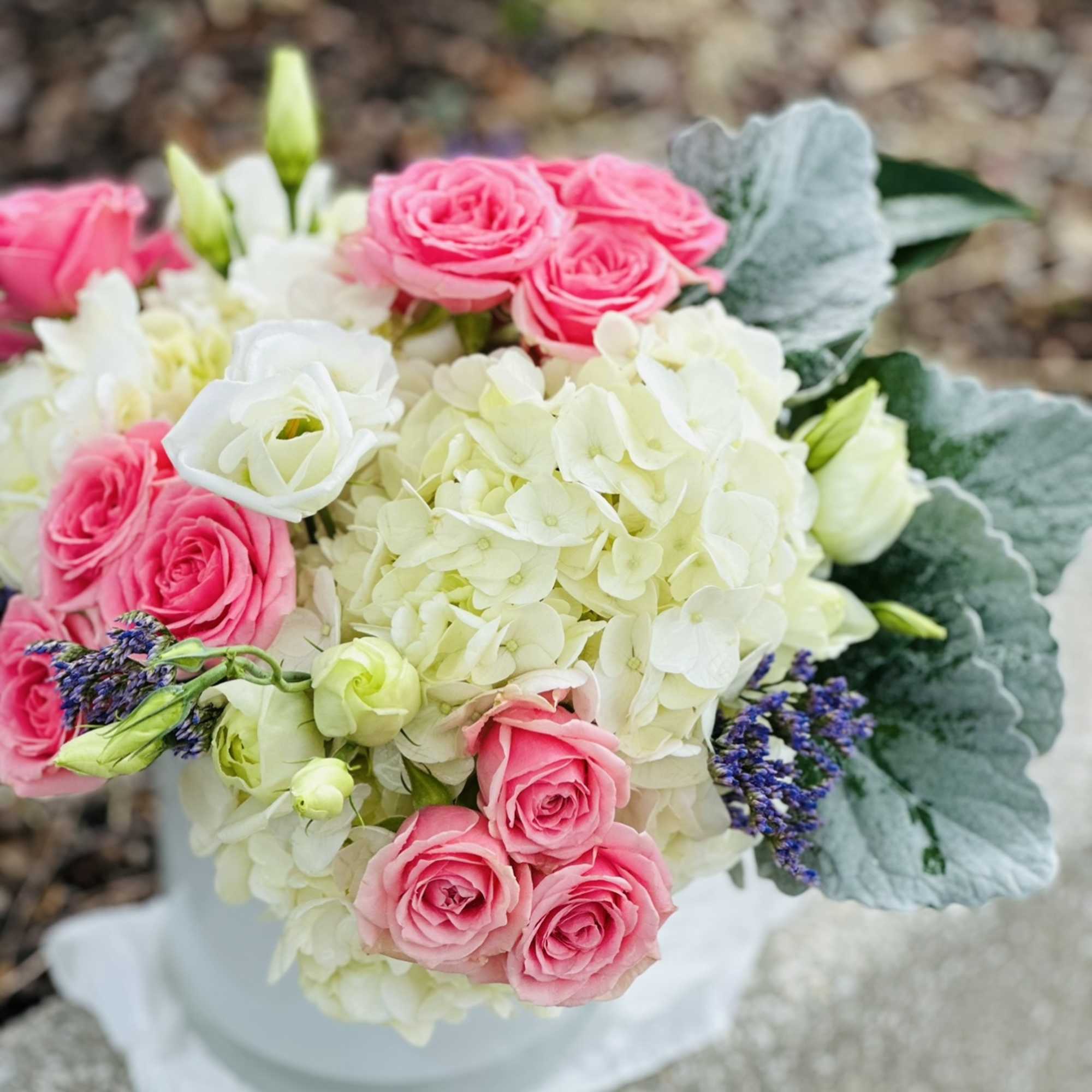 This angelic arrangement is as cute as it is pretty. Featuring the
