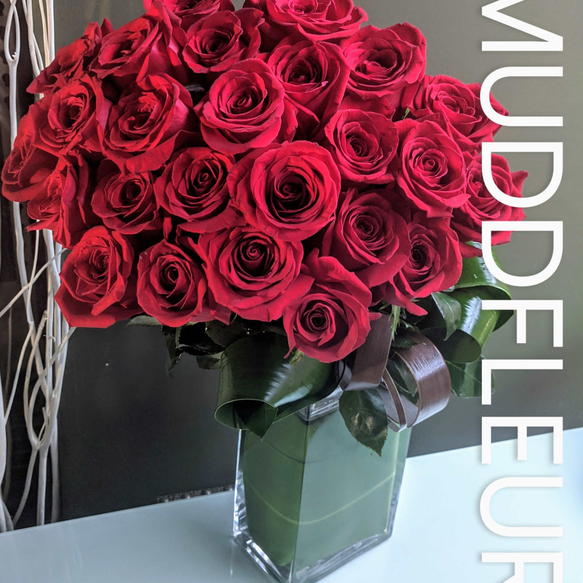 Ditch the grocery store flowers and send a modern arrangement of red