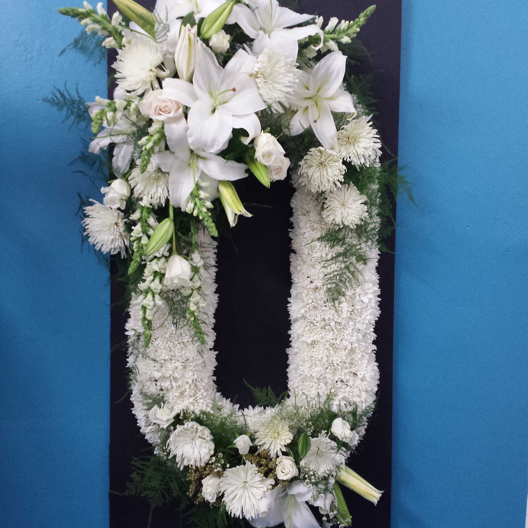 Oval wreath with different flowers and custom designs. Call for inquiry Oval wreath with different flowers and custom designs. Call for inquiry