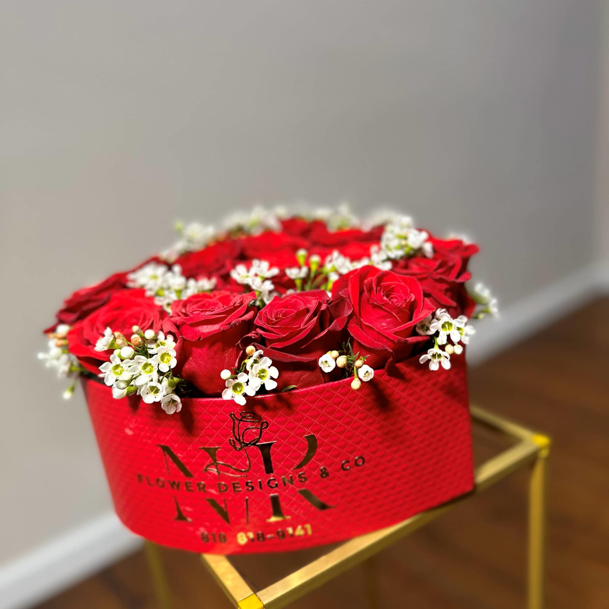 Heart shaped box filled with beautiful red roses! Delicate Baby Breath flowers
