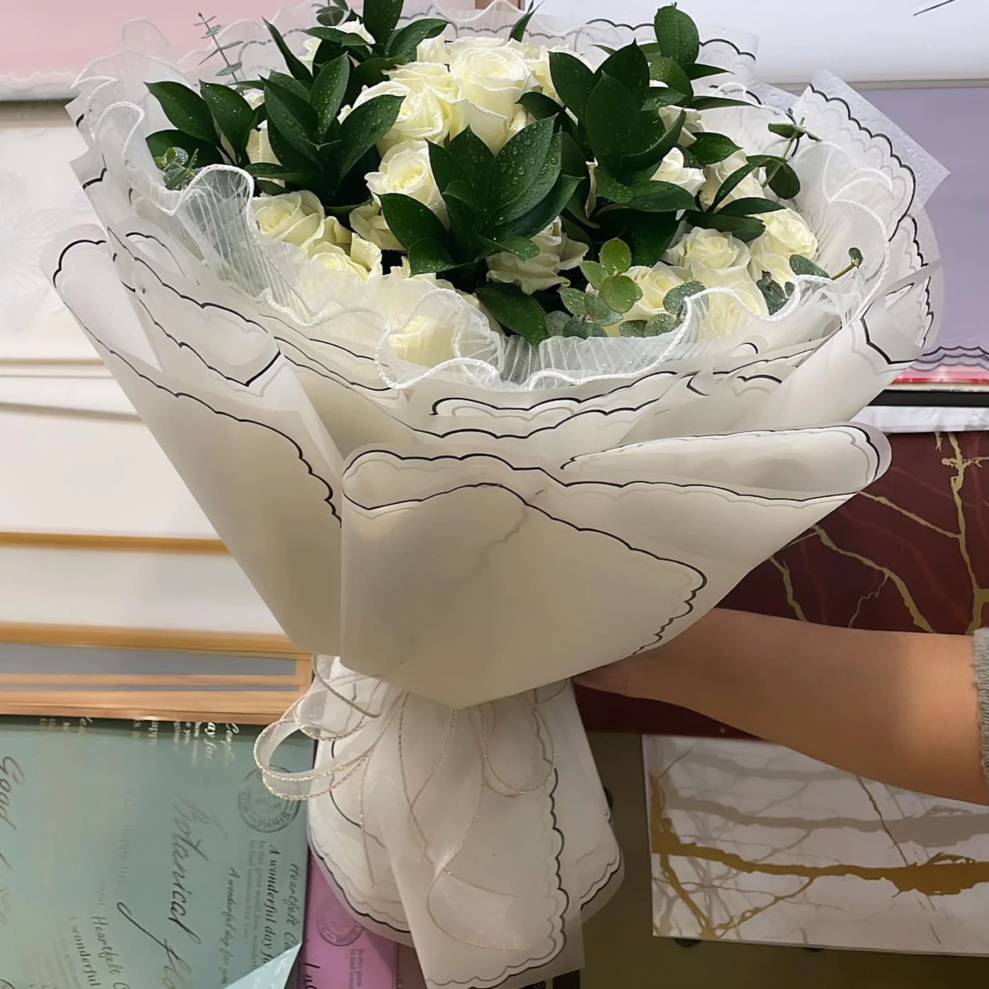 Introducing our exquisite bouquet of white roses, a timeless symbol of purity Introducing our exquisite bouquet of white roses, a timeless symbol of purity