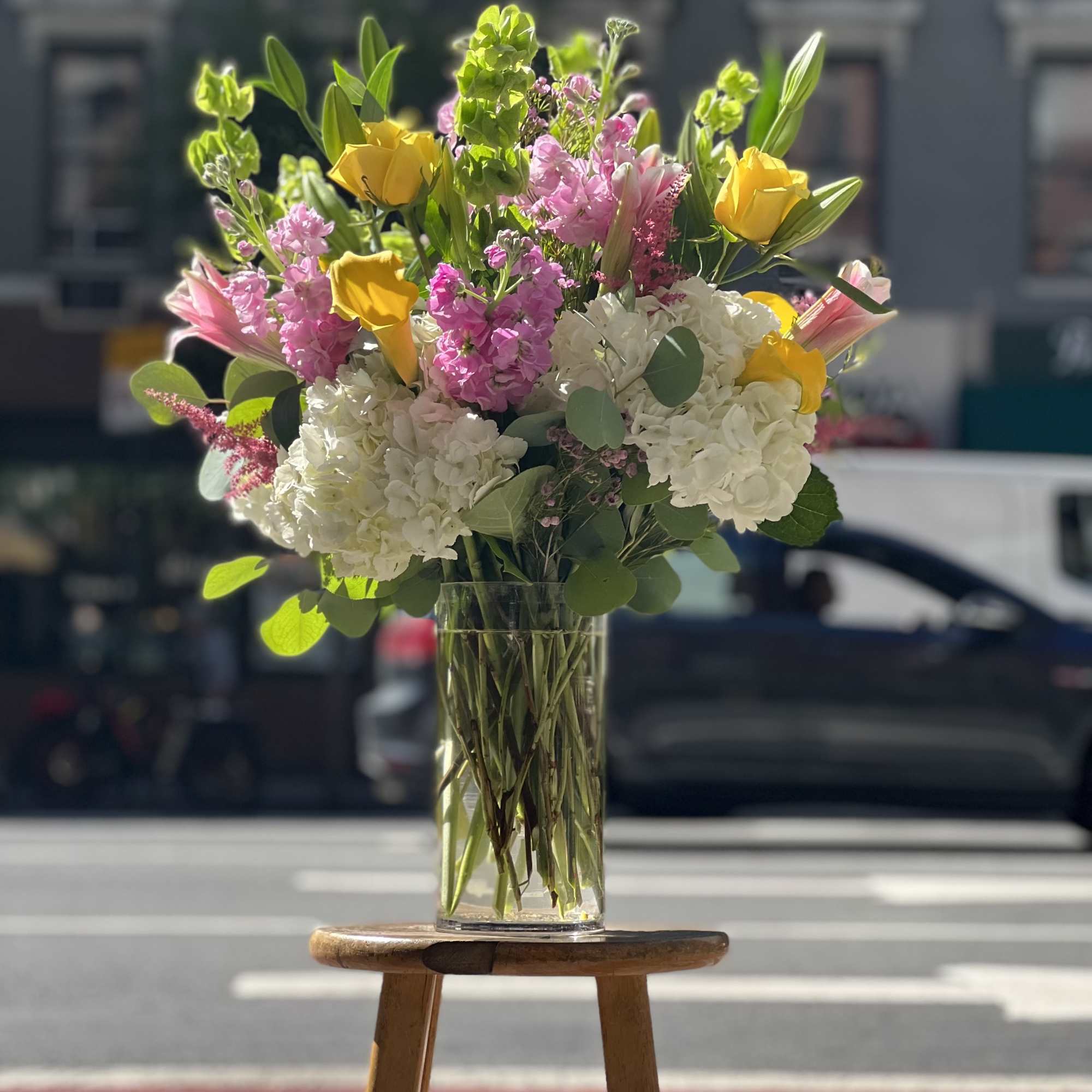 This lovey arrangement of bright, colorful and balanced flowers are ready to