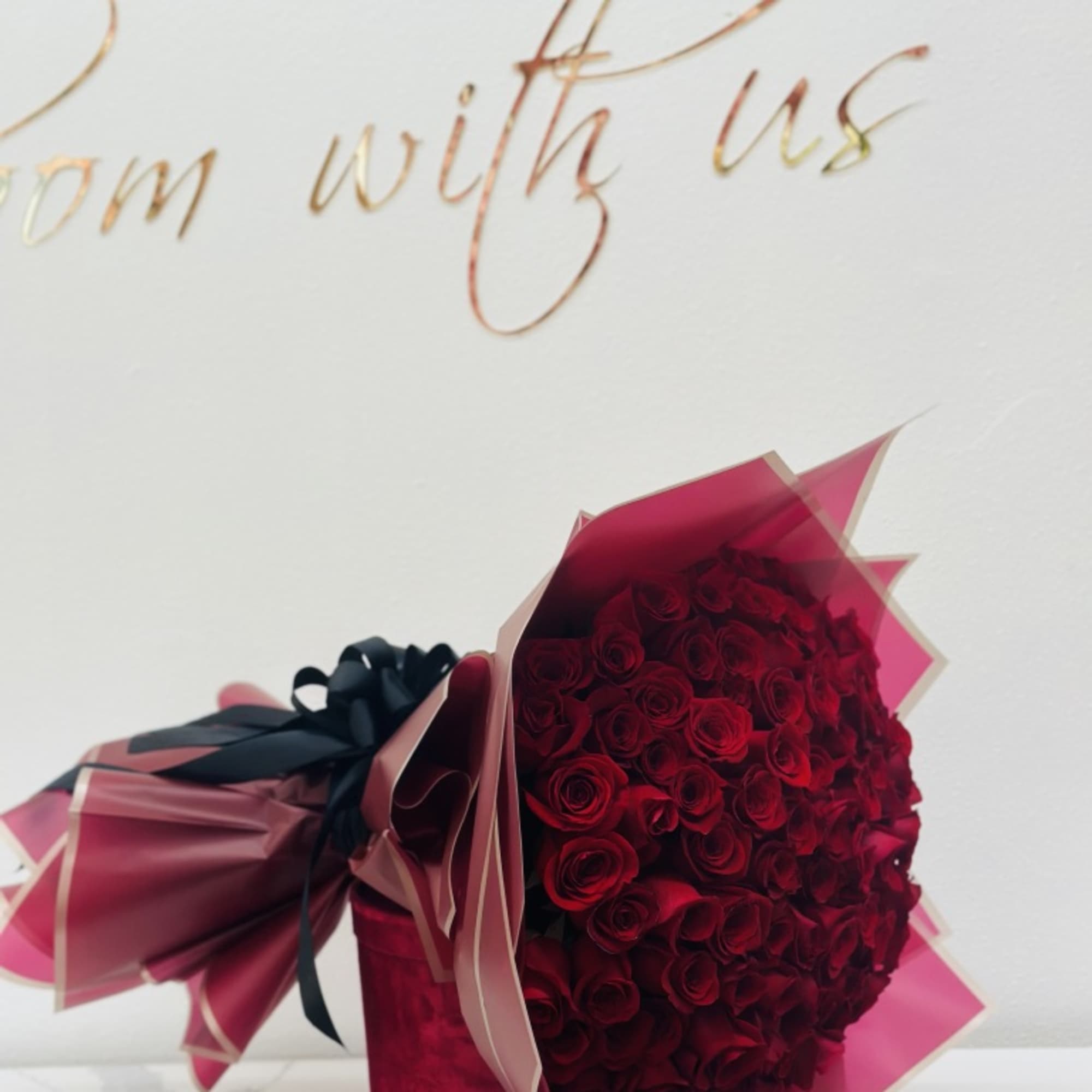 100 red roses bouquet wrapped 
