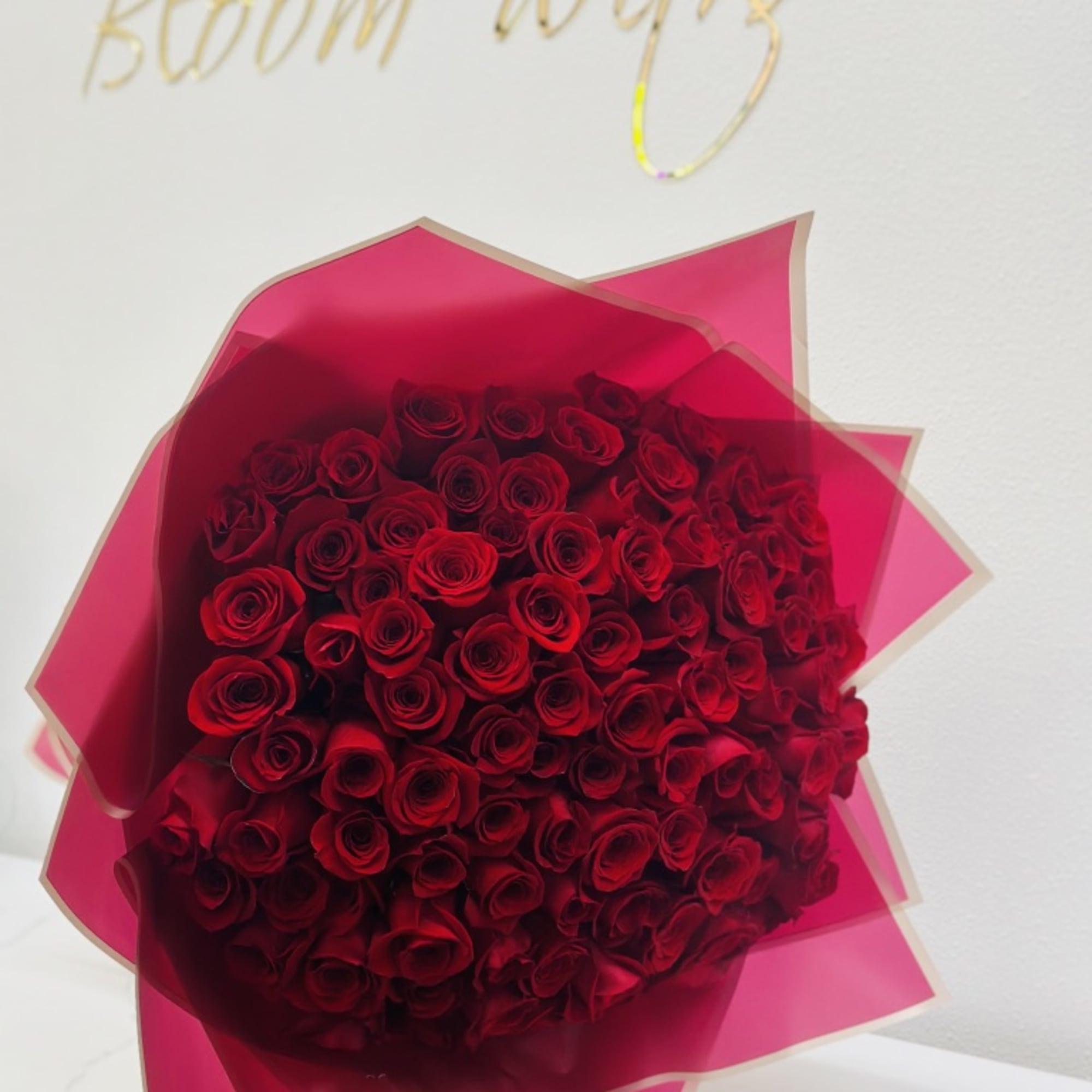 100 red roses bouquet wrapped 
