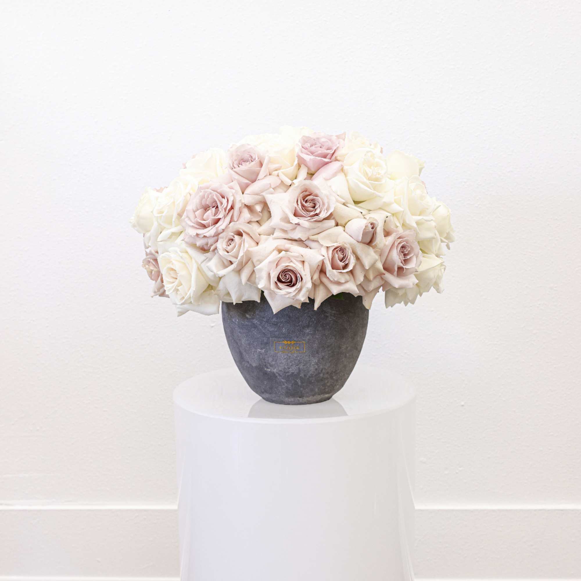 Bring beauty to the table with elegant arrangement, presented in a round