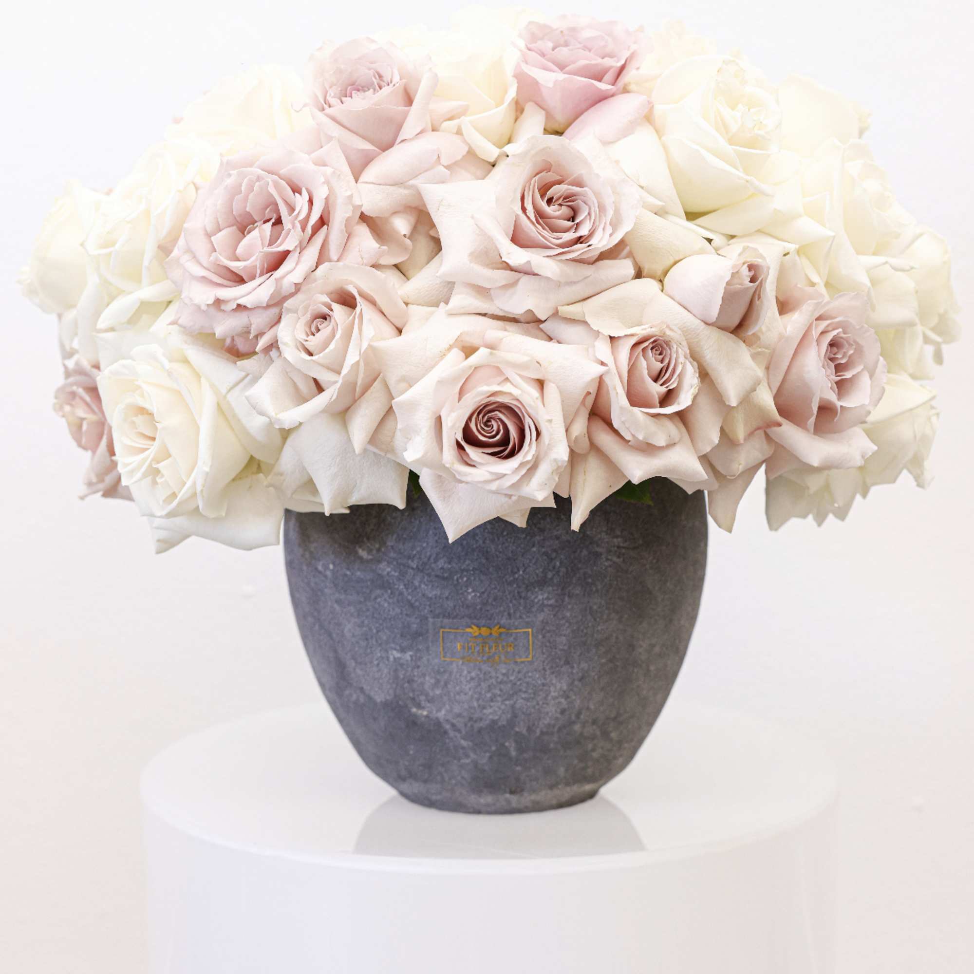 Bring beauty to the table with elegant arrangement, presented in a round