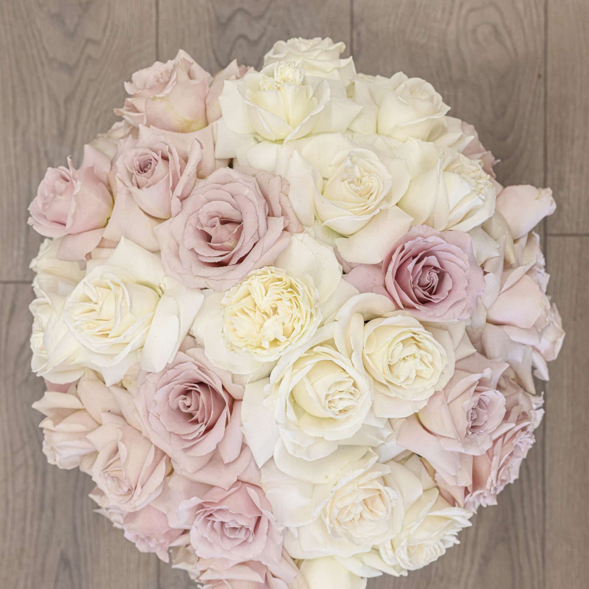 Bring beauty to the table with elegant arrangement, presented in a round