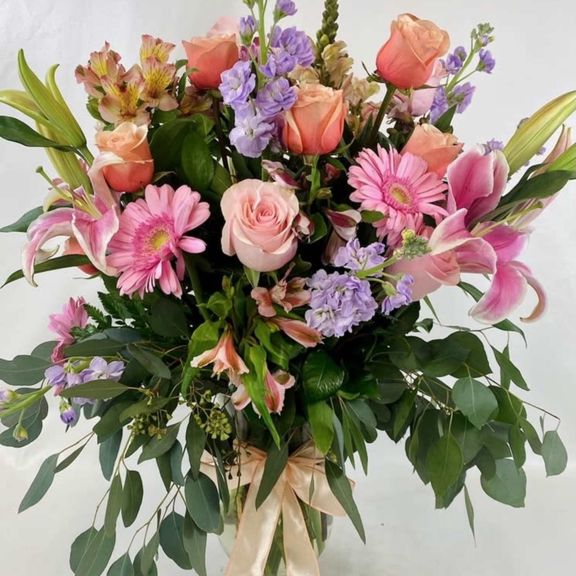 Tall and impressive flower arrangement, spring blooms in pastel colors in an