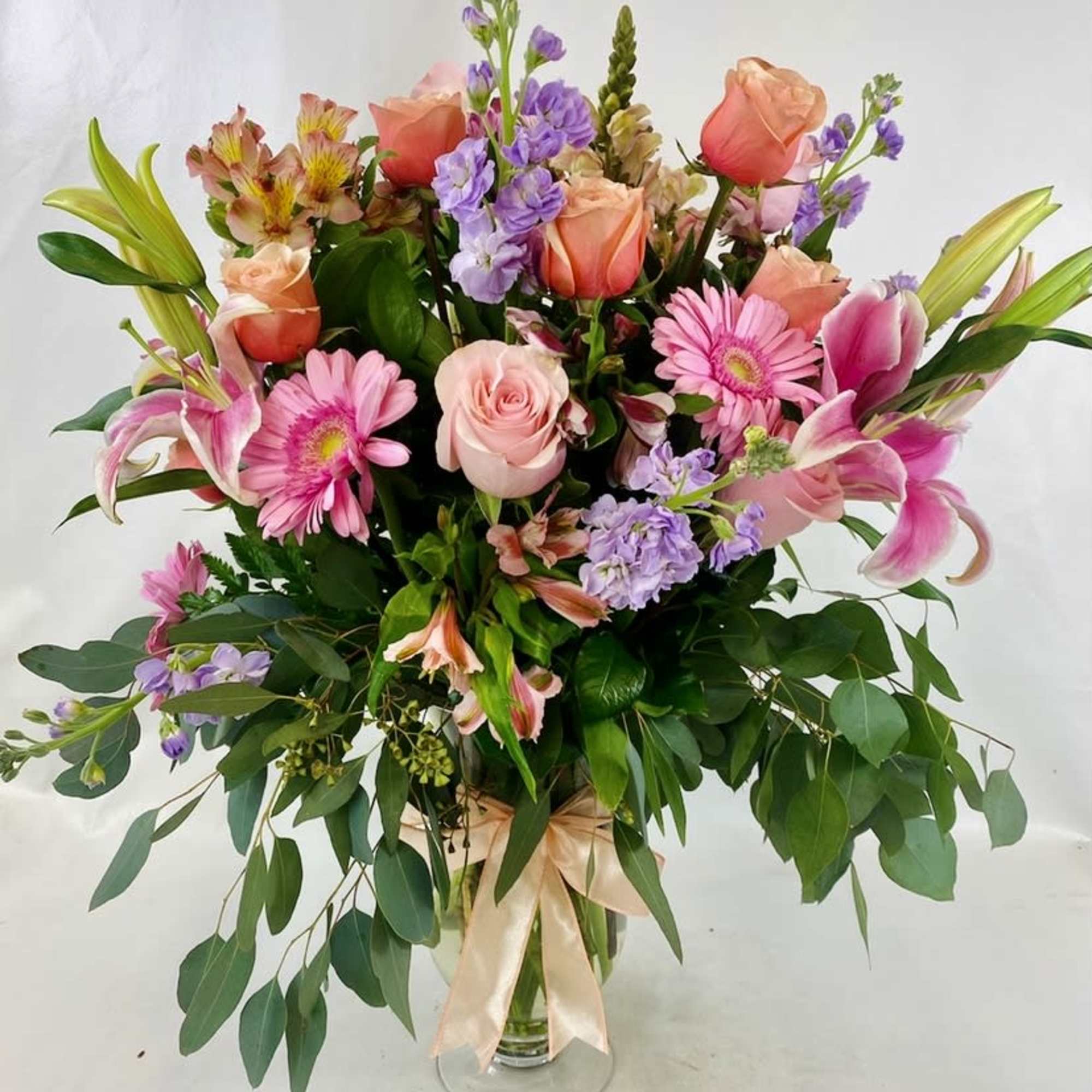Tall and impressive flower arrangement, spring blooms in pastel colors in an