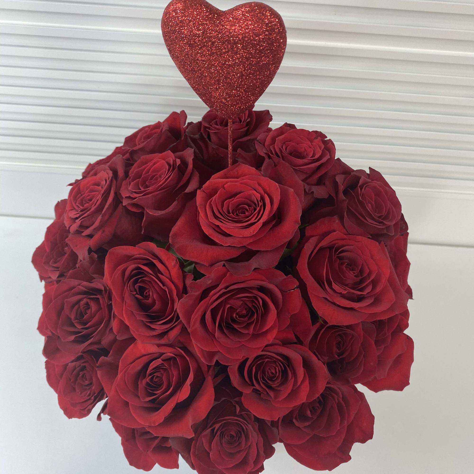 Romantic black round box with 38-40 red roses. 
