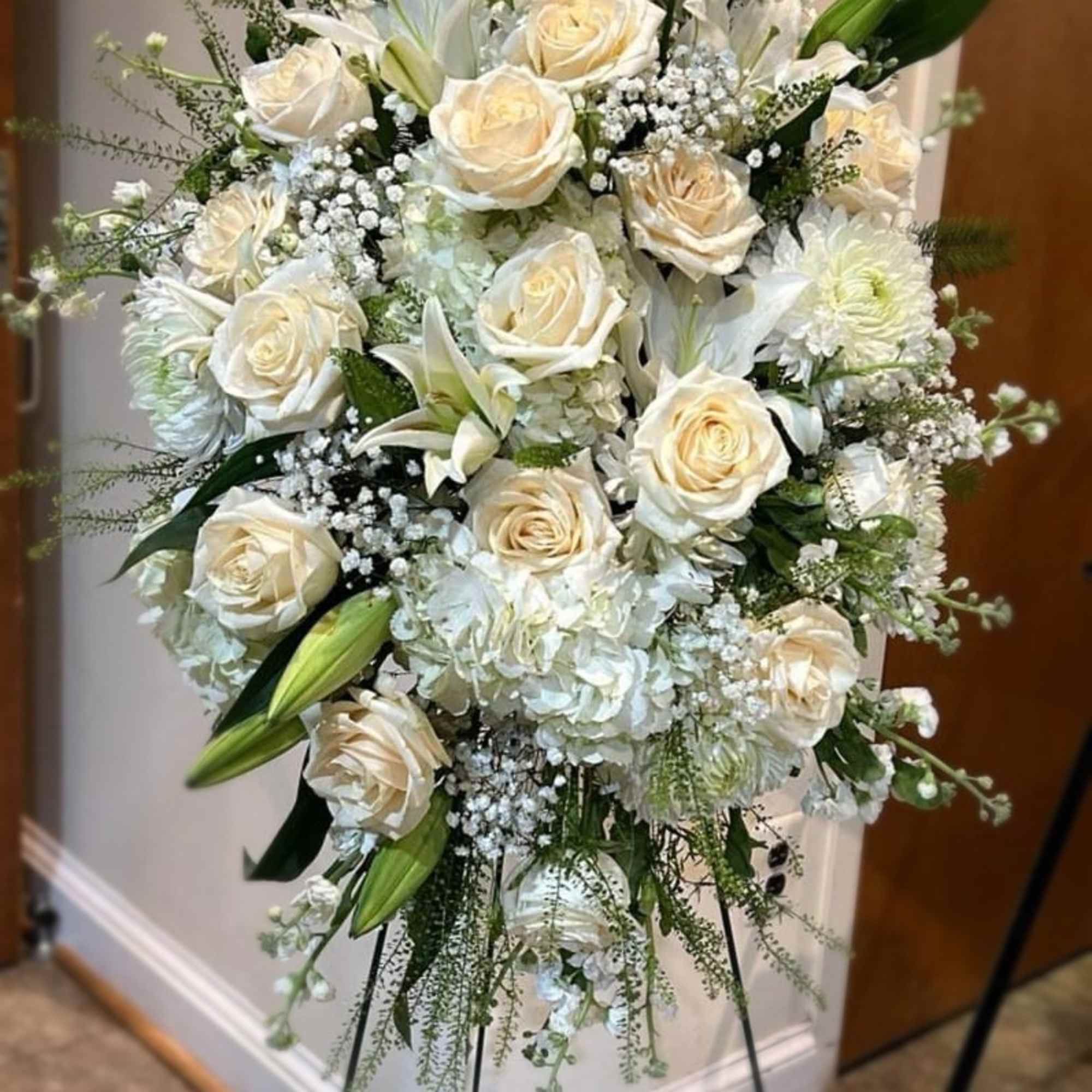Standing spray with roses, stock, lilies, mums