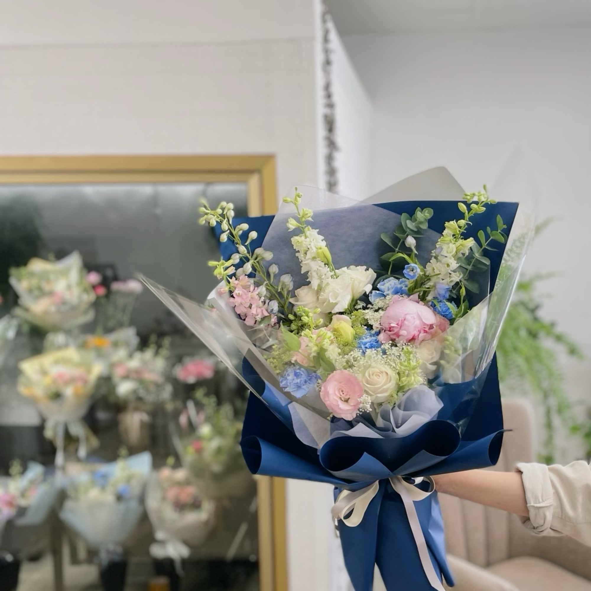 We create a custom designer choice Valentine or special occasion hand-tied bouquet.