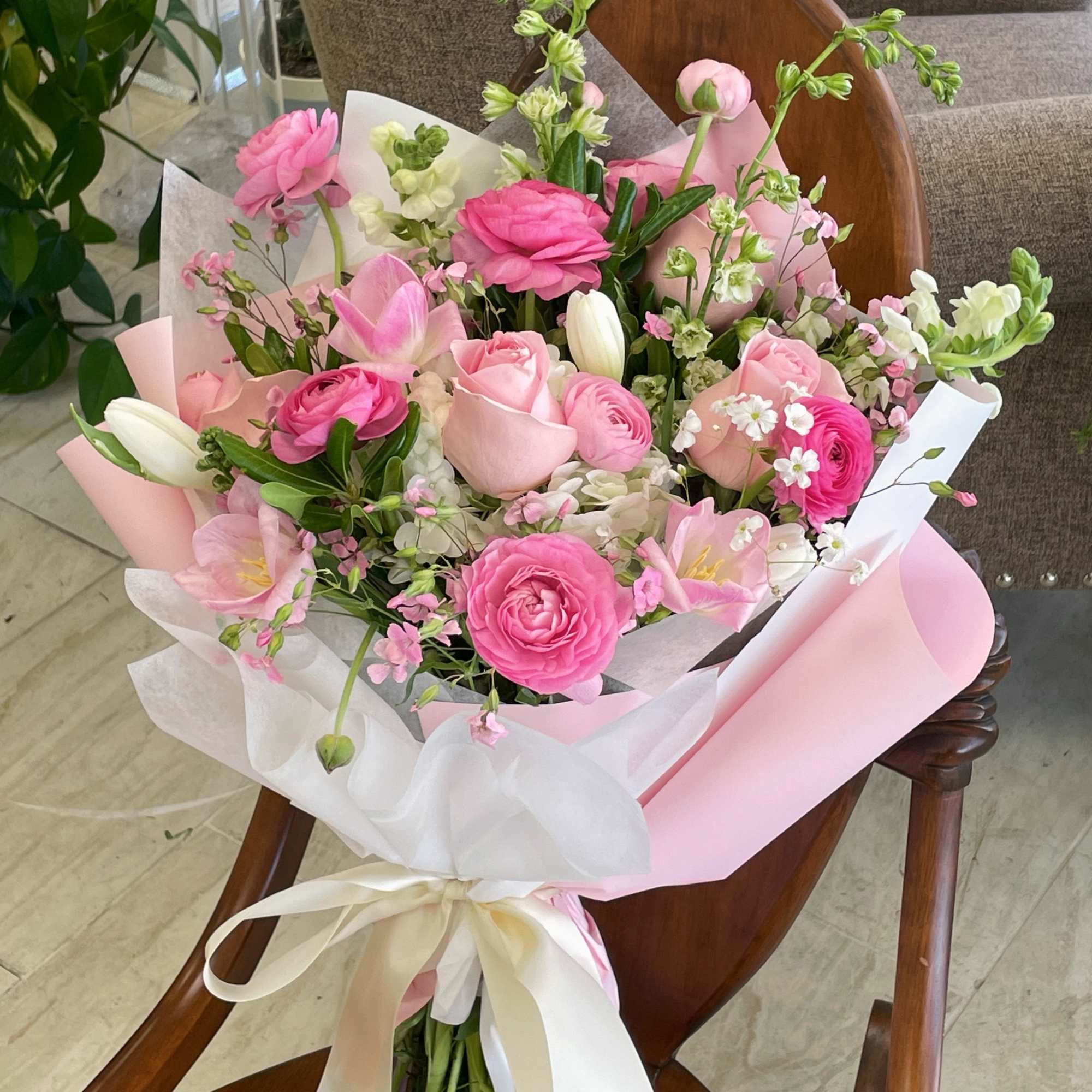 We create a custom designer choice Valentine or special occasion hand-tied bouquet.