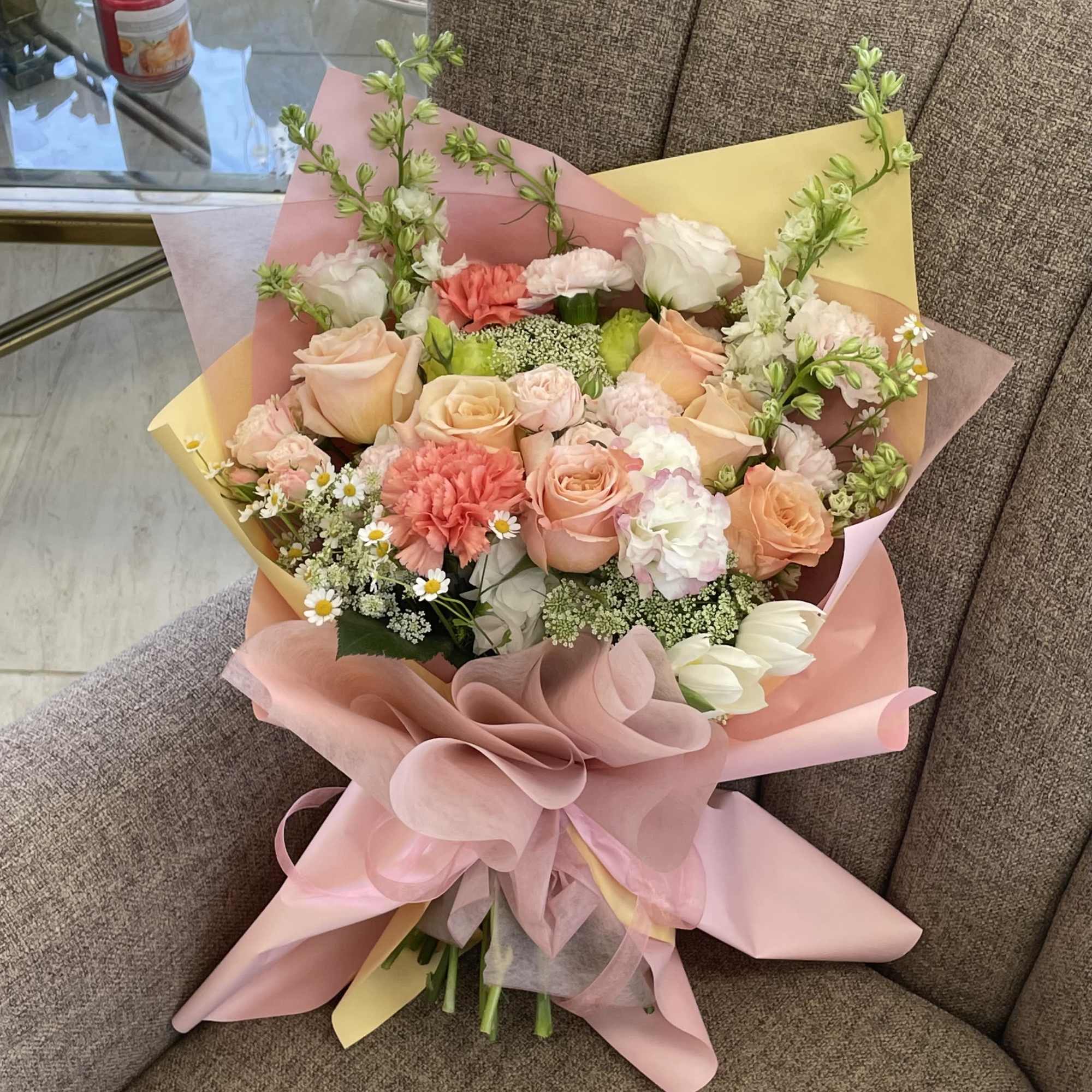 We create a custom designer choice Valentine or special occasion hand-tied bouquet.