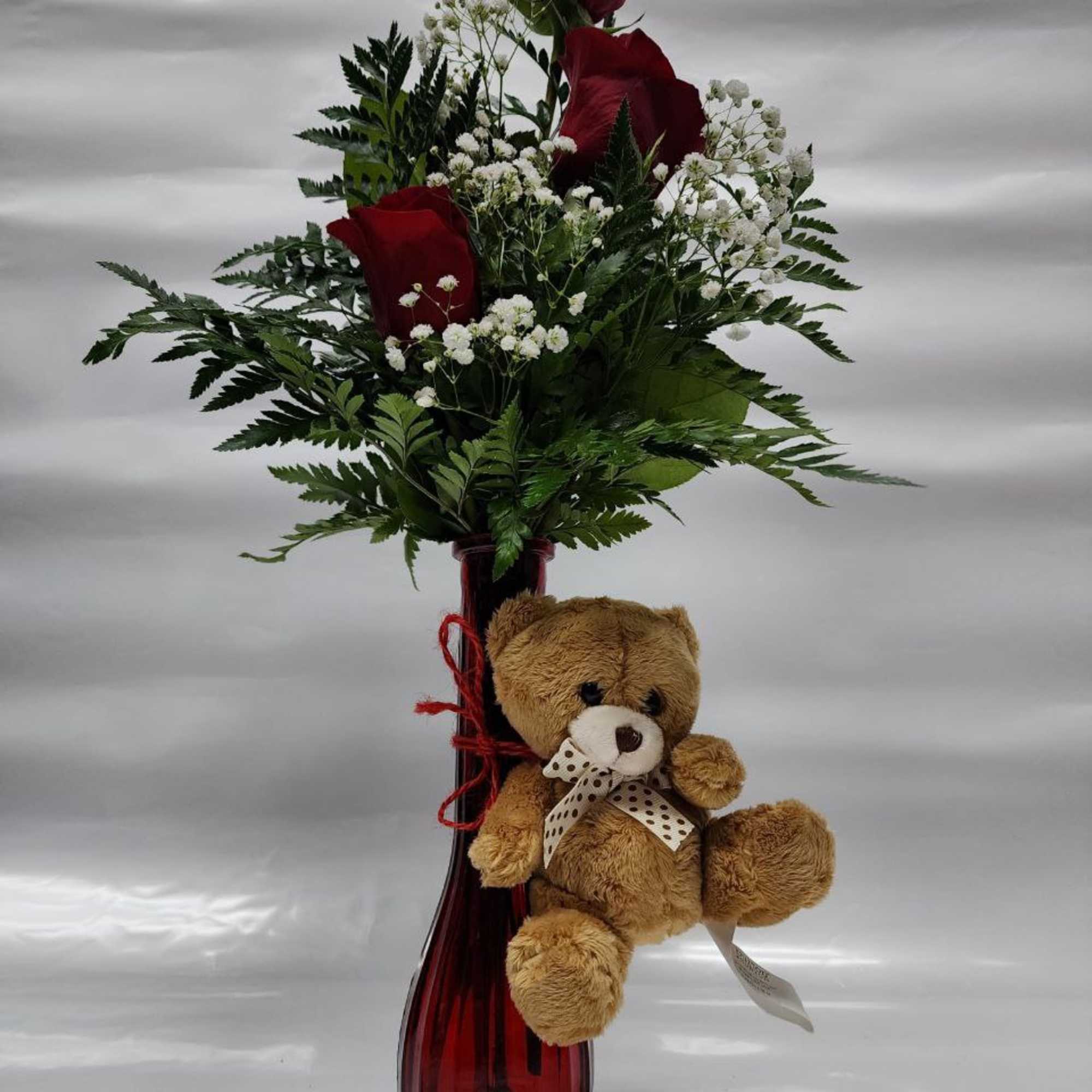 3 Red Roses   in a Red Bubo vase ,white baby