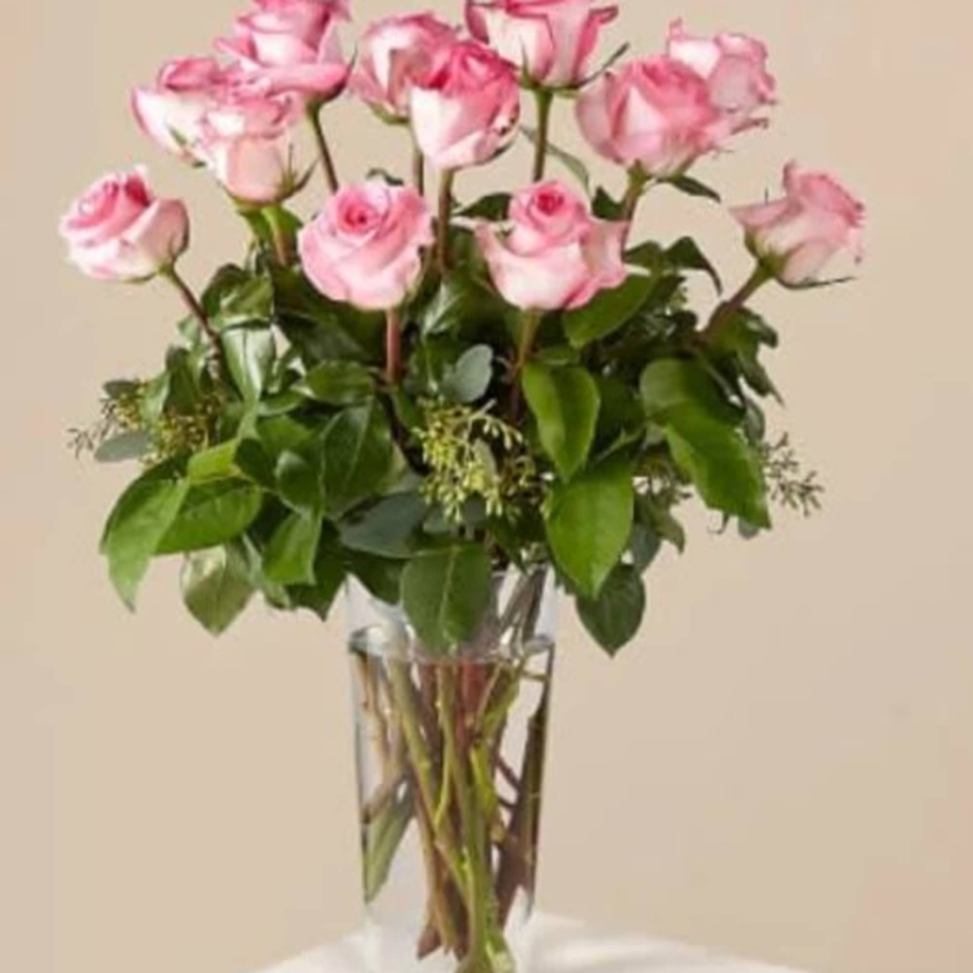 Picture-perfect soft pink roses make a beautiful gift for the lovely lady