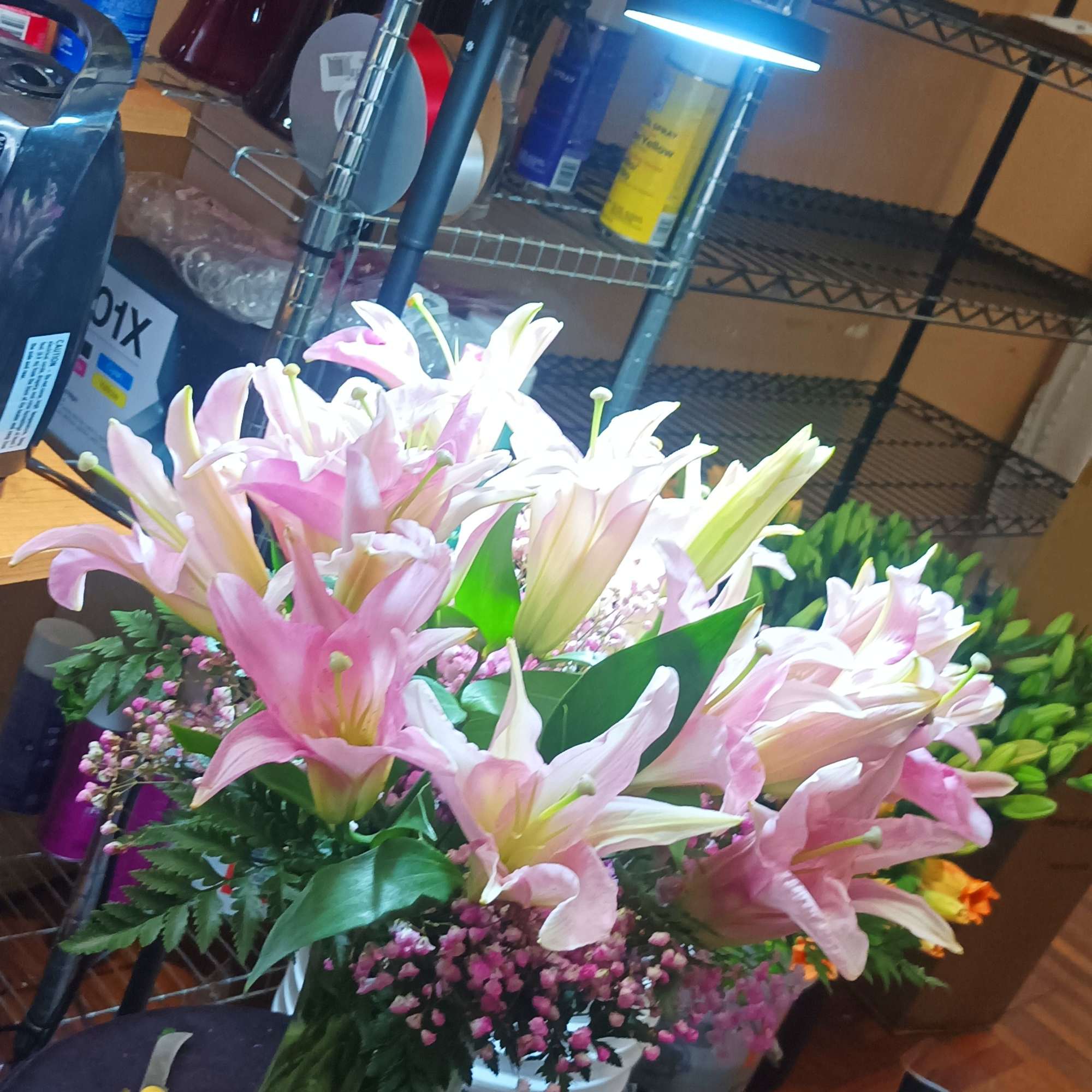 Stargazer lilies with limonium/caspia or wax flower and pink babys breath fillers Stargazer lilies with limonium/caspia or wax flower and pink babys breath fillers