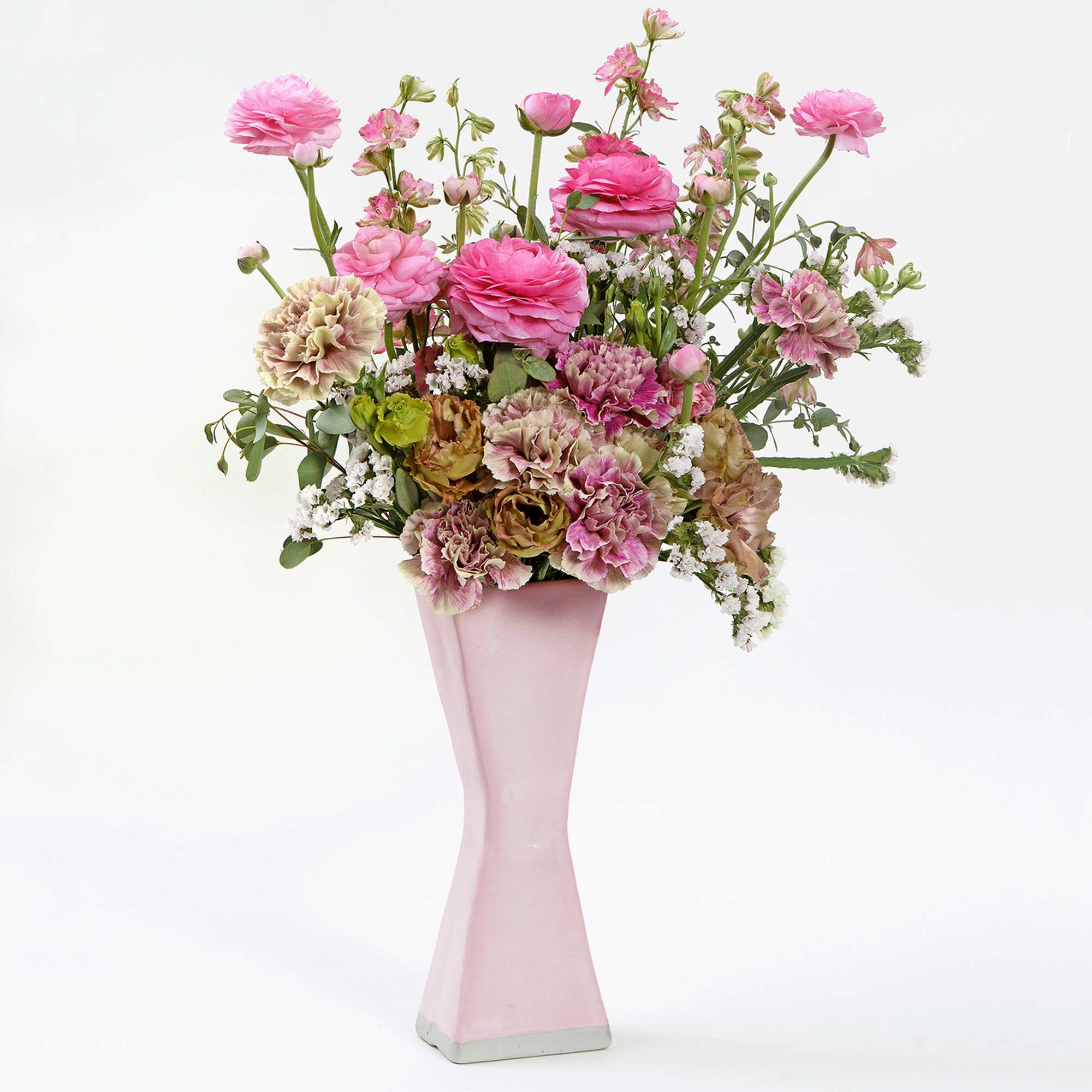 A handmade matte pink ceramic vase 10&quot; tall by 4&quot; wide filled