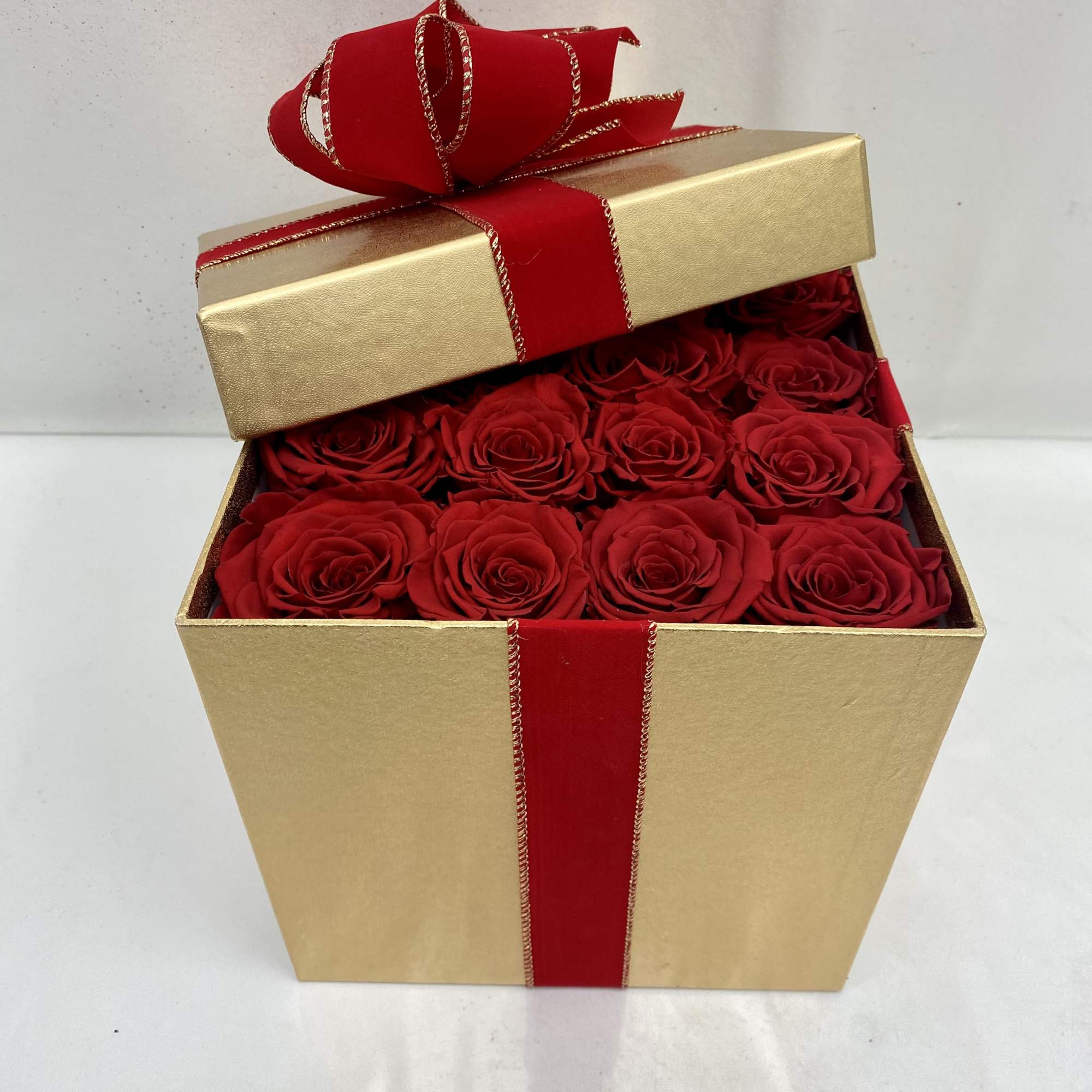 Surprise her with 16 real preserved roses that last up to 2