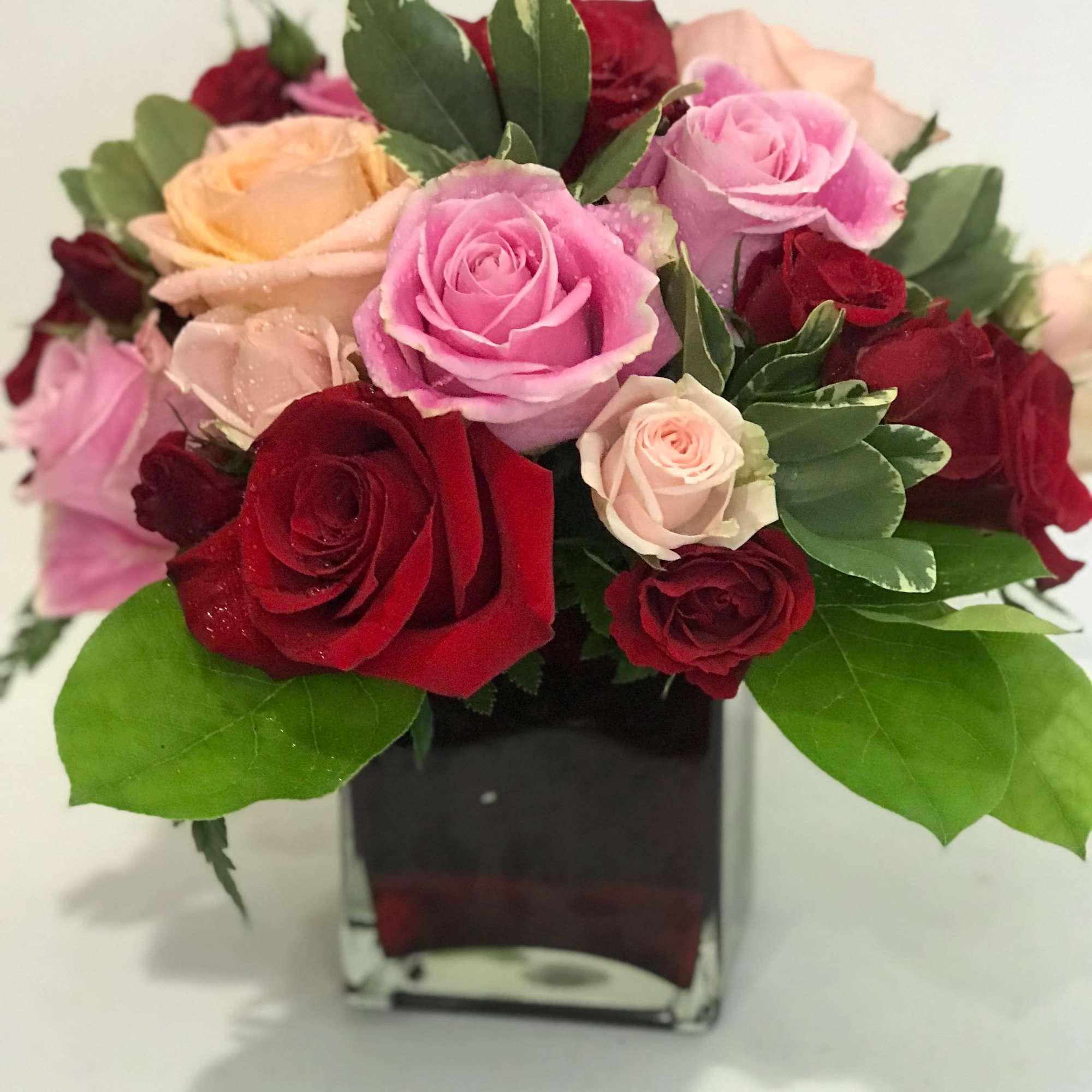 Surprise her with roses in four gorgeous shades of love artistically arranged Surprise her with roses in four gorgeous shades of love artistically arranged