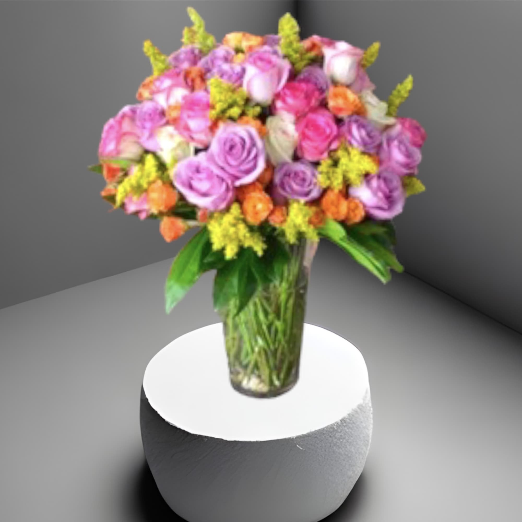 A large arrangement of 4 dozen multi-colored roses accented with foliage in