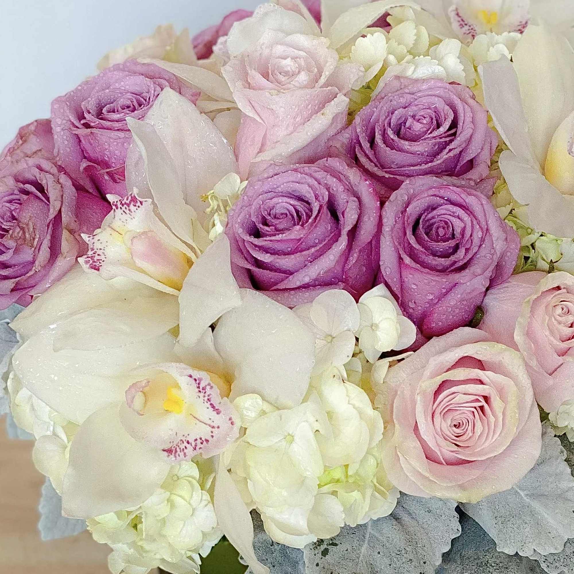 Classic and Beautiful, this large arrangement whispers luxury. Soft pinks, whites and